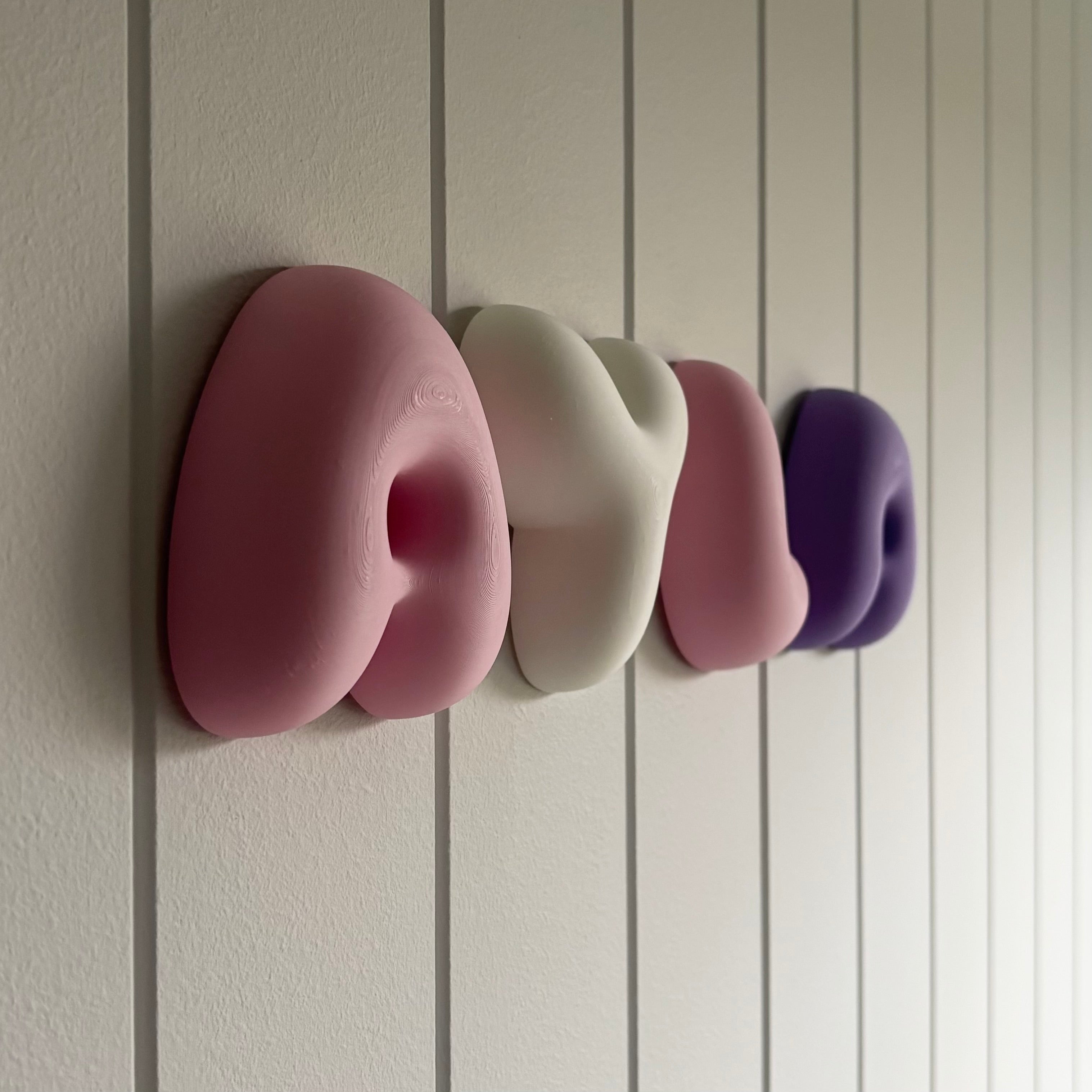 Close-up of personalised bubble name letters made from lightweight PLA, modern nursery wall décor with soft rounded 3D lettering.