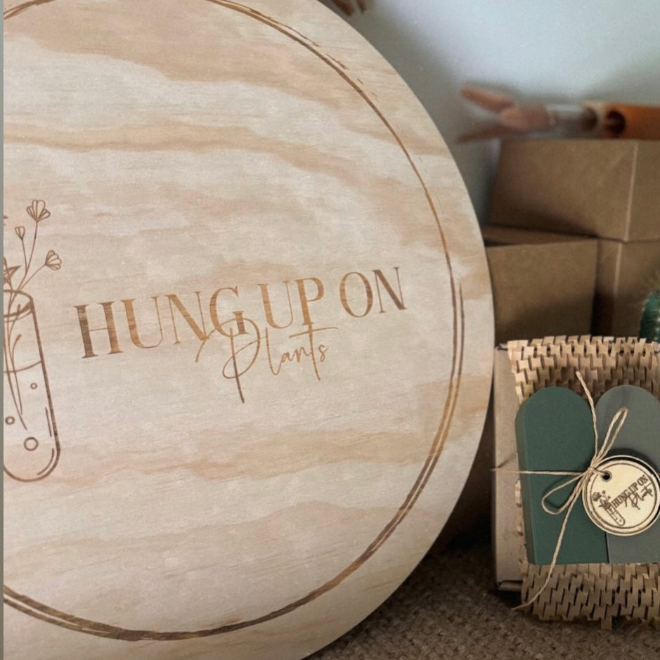 Custom round engraved timber business sign for plant shop, personalised wooden signage with logo for small business branding Australia