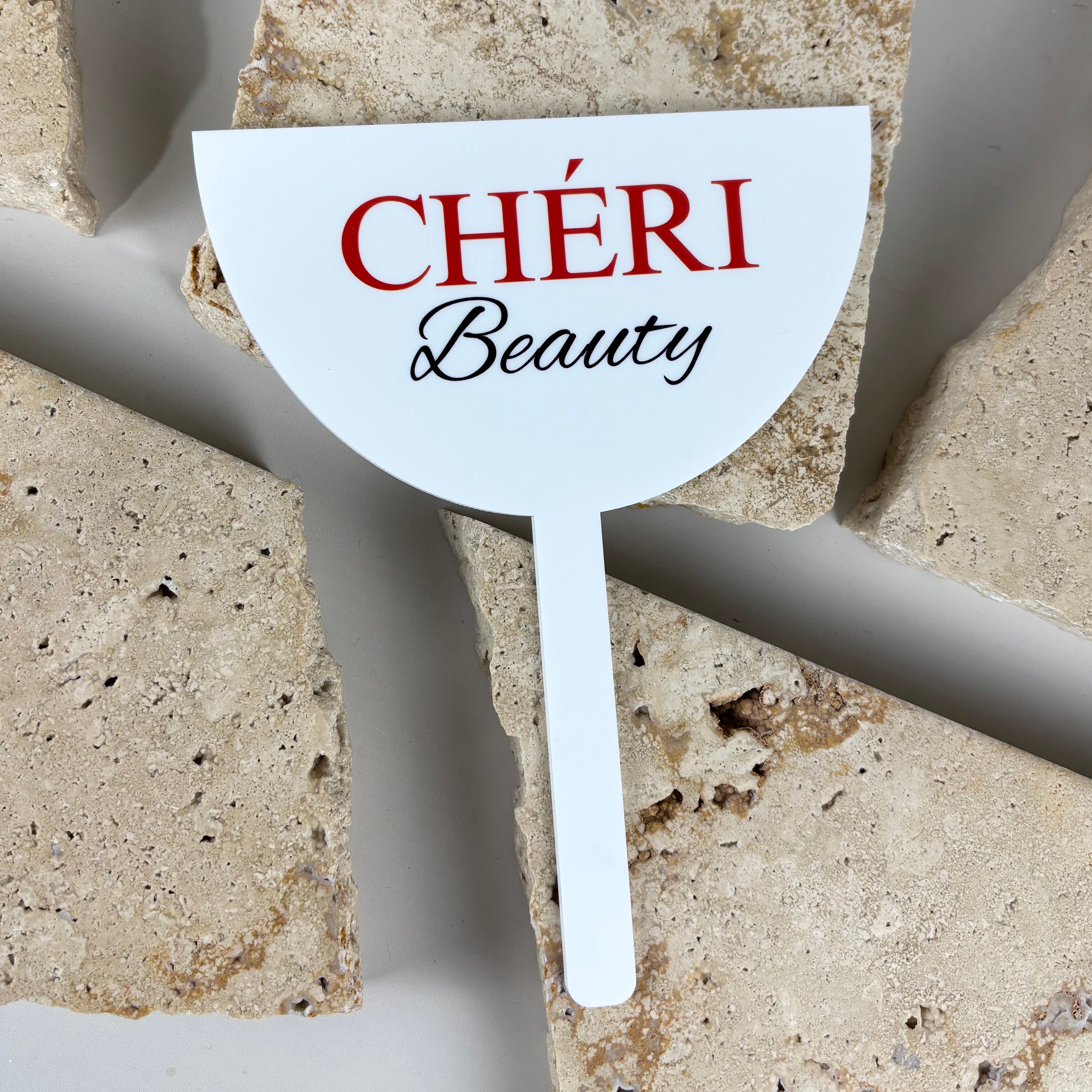 Custom UV printed face shield with CHÉRI Beauty logo on white acrylic, professional hair and beauty salon branding face shield
