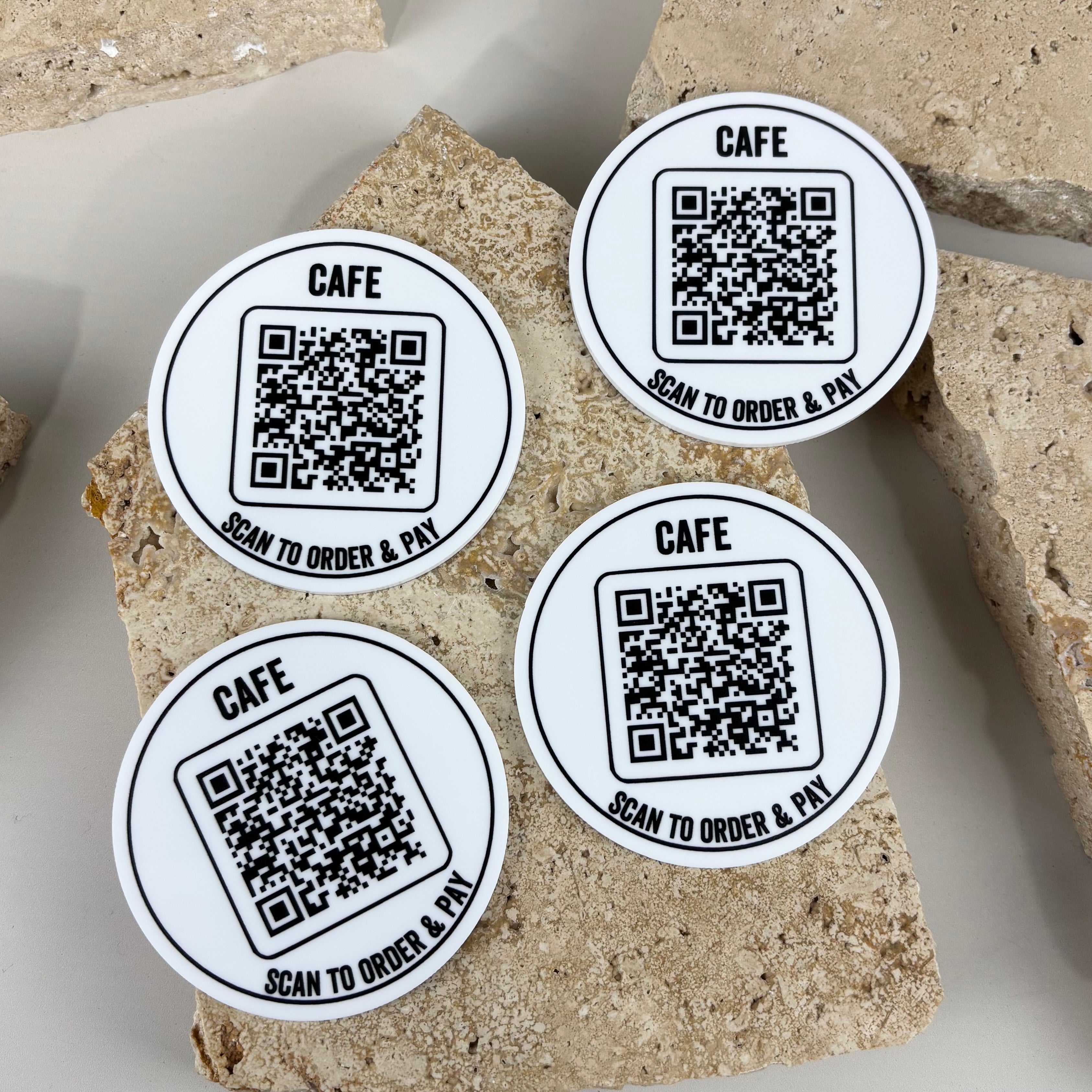 Custom QR code table discs for cafés, restaurants, bars and hospitality venues. Durable acrylic scan-to-order and pay signs featuring high-quality QR codes, designed to streamline ordering, improve customer experience and reduce wait times in busy venues.