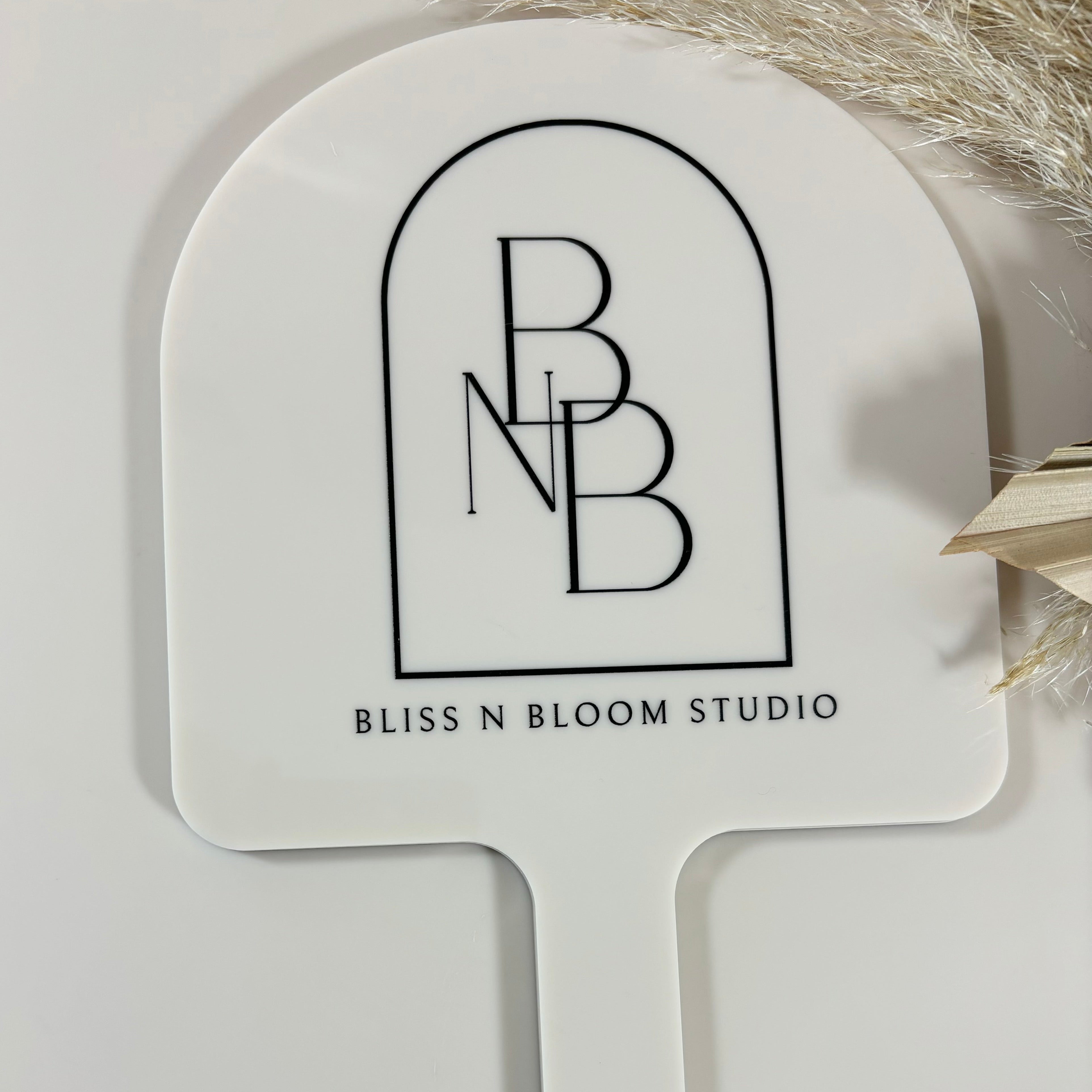 Bliss and Bloom Studio logo on branded arched mirror