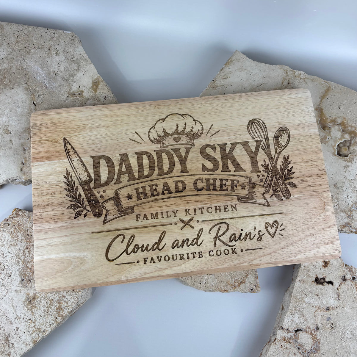Personalised engraved wooden chopping board featuring a custom family kitchen design, name and chef details, creating a unique gift for dads, home cooks and special occasions.