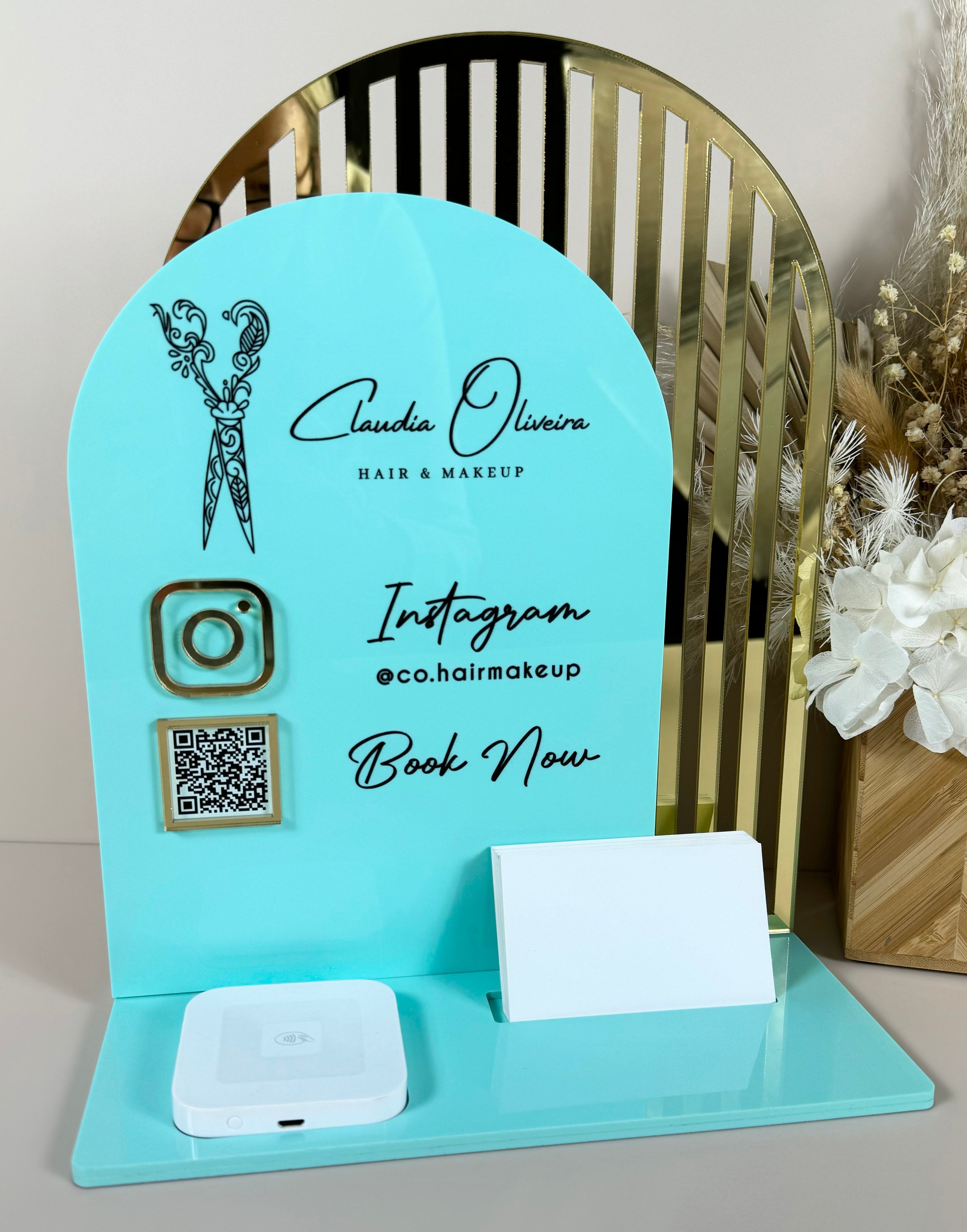 Teal custom social media stand with Instagram details and business card holder