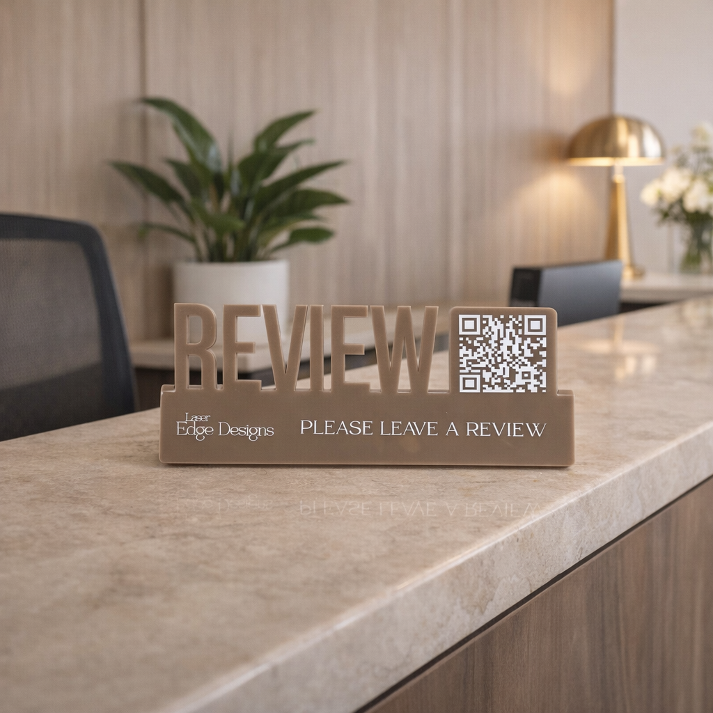 QR code review stand with raised lettering acrylic sign on reception counter