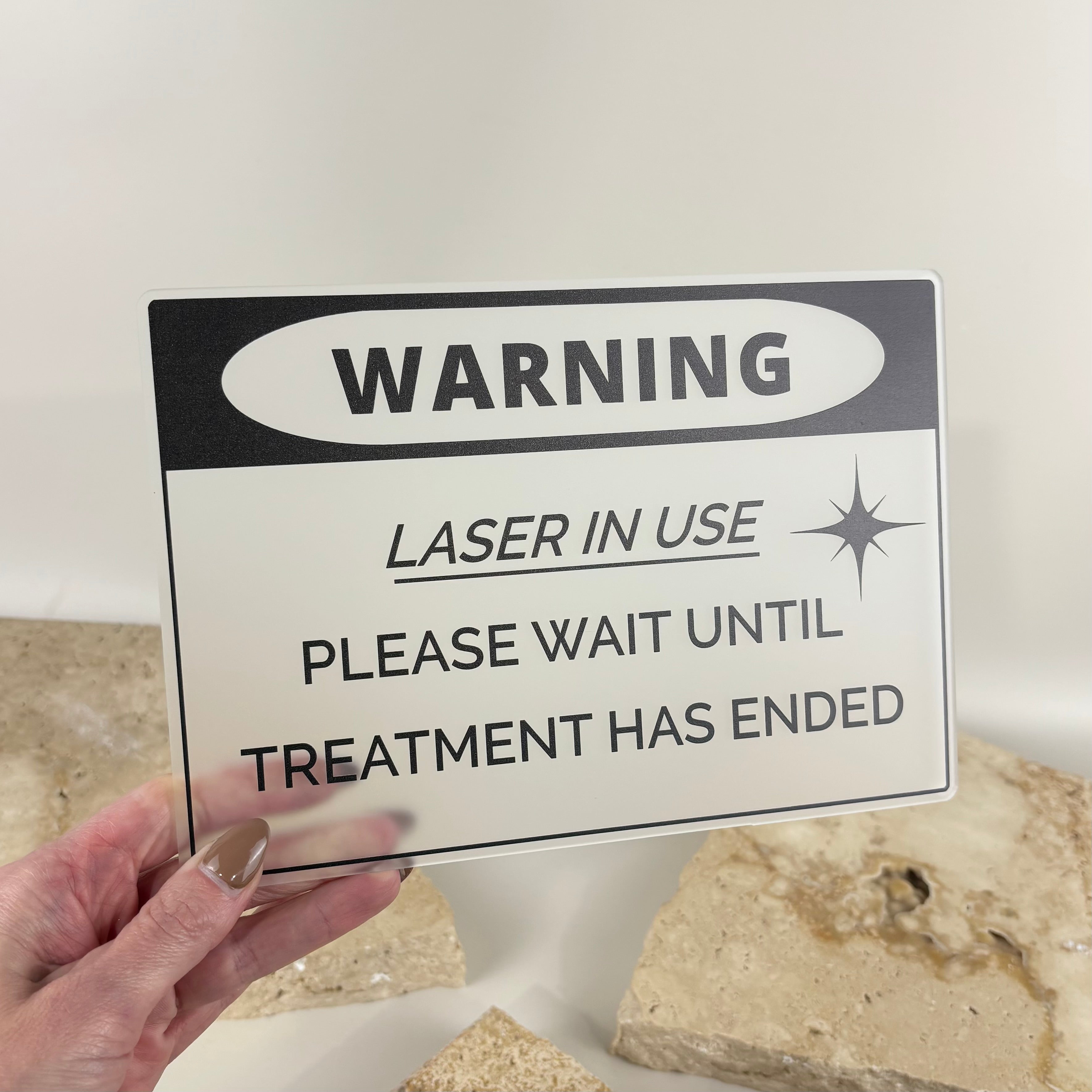 Custom acrylic laser safety sign displaying “Warning Laser in Use – Please Wait Until Treatment Has Ended”, ideal for beauty salons, cosmetic clinics, laser treatment rooms, skin clinics and medical aesthetics businesses. Professional laser room door sign with UV printed black text on clear acrylic.