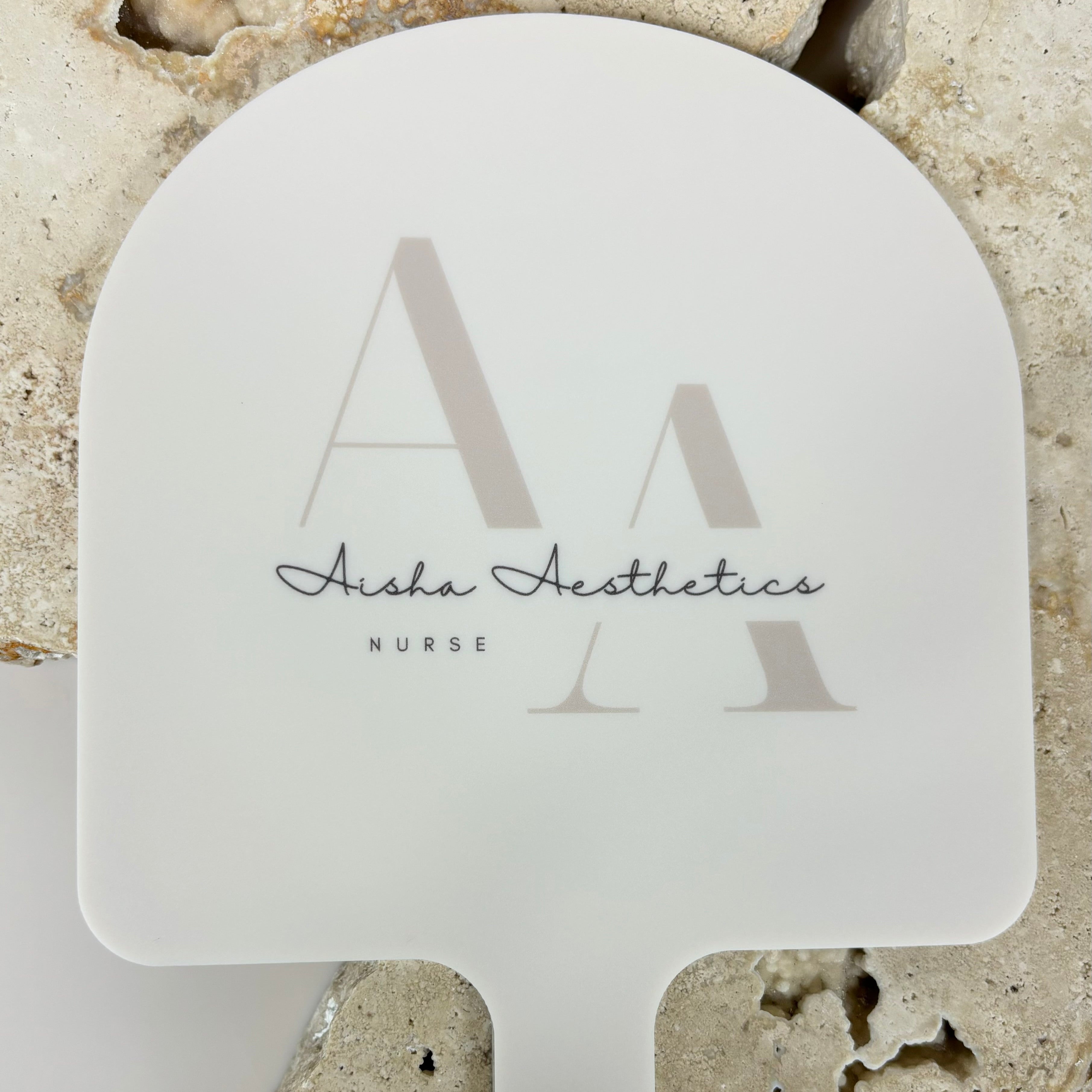 Personalised arched mirror with Aisha Aesthetics logo