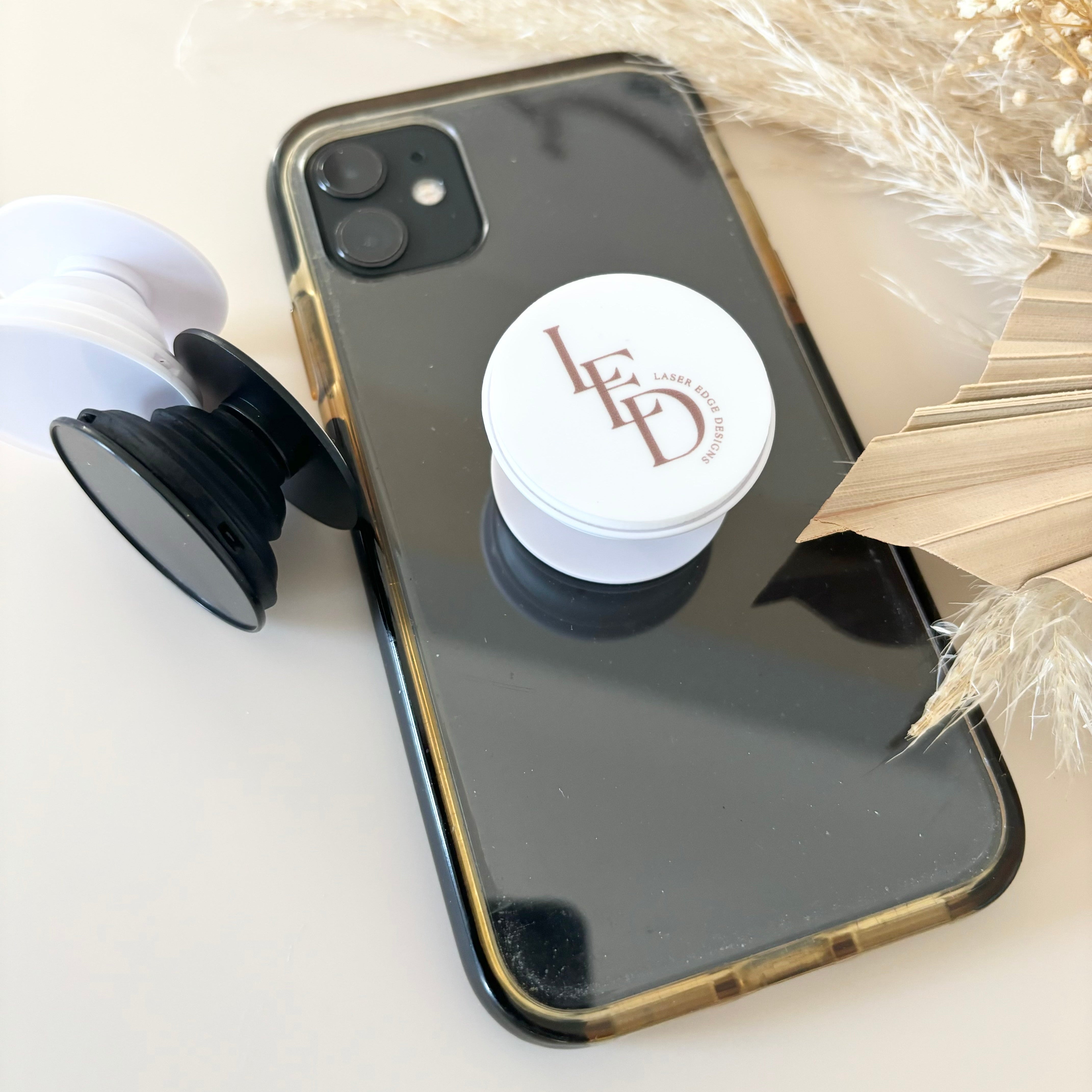 Custom phone grip side view showing extended grip on phone