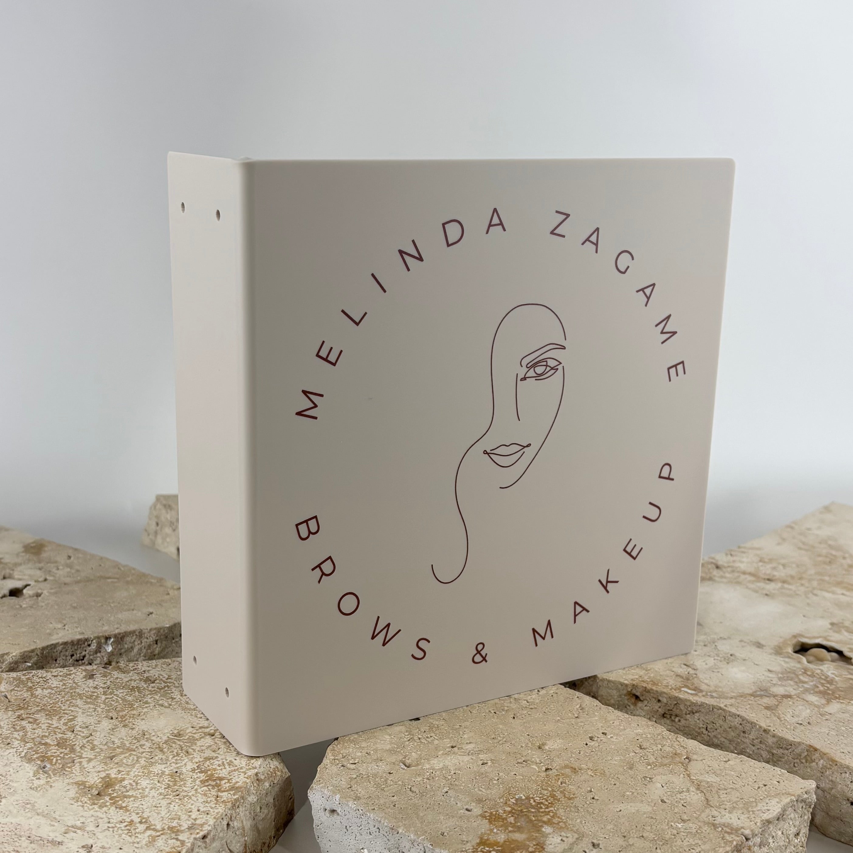 Custom blade sign for brow studios, makeup artists and beauty salons featuring UV printed branding and logo on a double-sided hanging sign. Professional outdoor business signage designed to increase visibility, attract clients and enhance salon storefront branding.