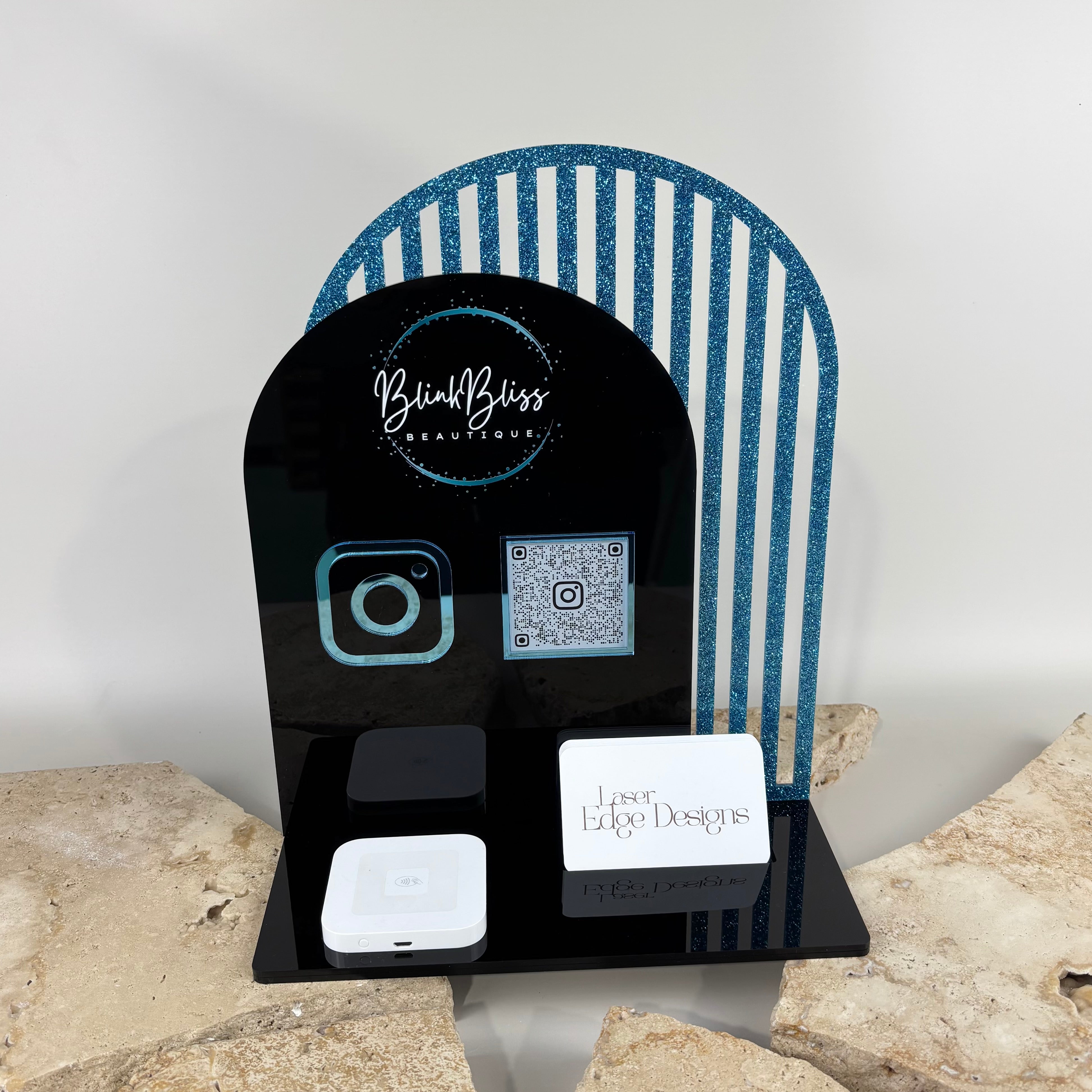Custom black acrylic NFC social media business station with Instagram QR code, Google review stand, business card holder and blue glitter arch backdrop for beauty salons, lash artists, brow studios, hair salons, barbers and small businesses.