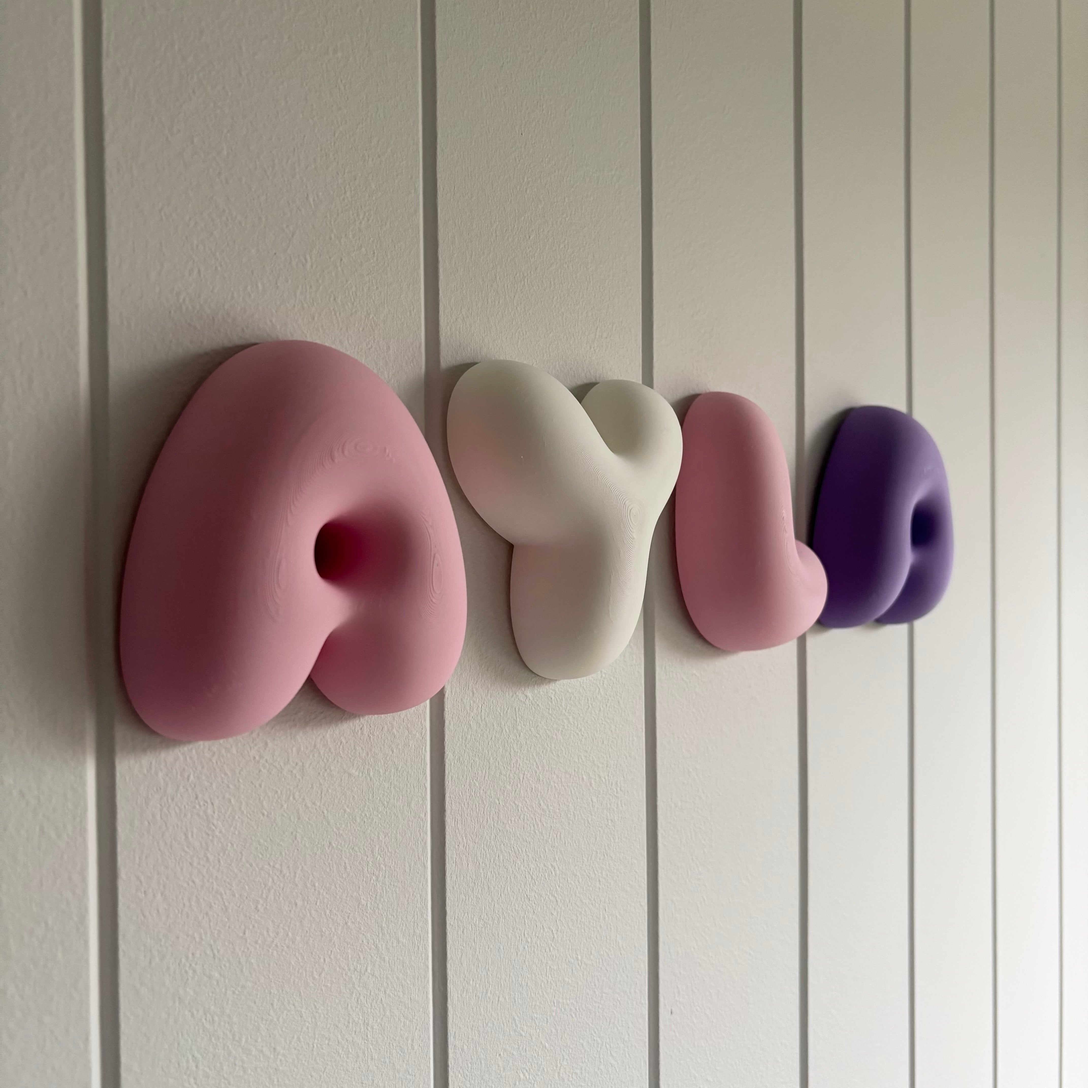 Side view of custom bubble name wall letters showing the rounded 3D design, personalised PLA name sign for nursery or children’s bedroom.