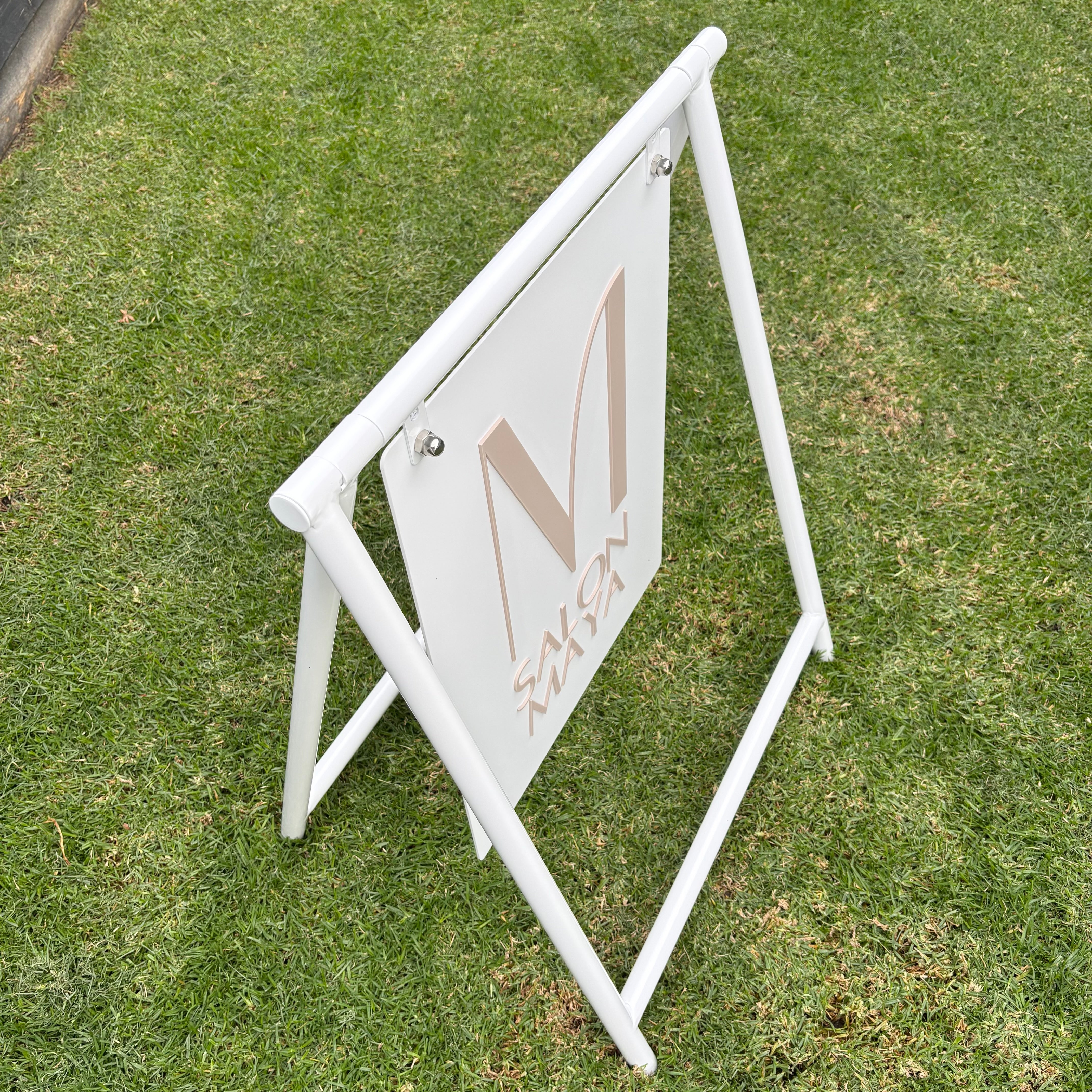     Modern white A Frame business sign with suspended acrylic panel and 3D lettering for luxury salon signage