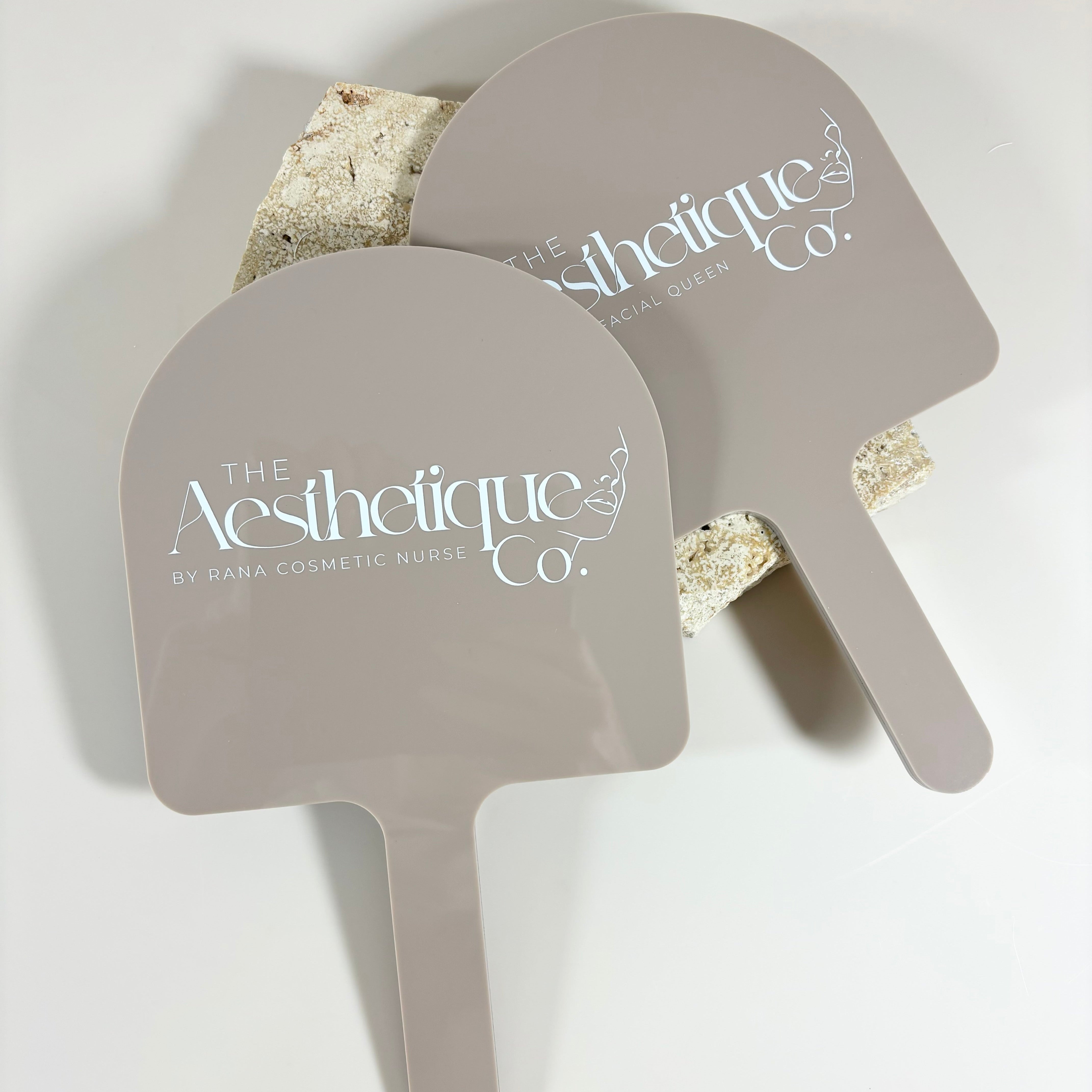The aesthetique co branding on arched salon mirror