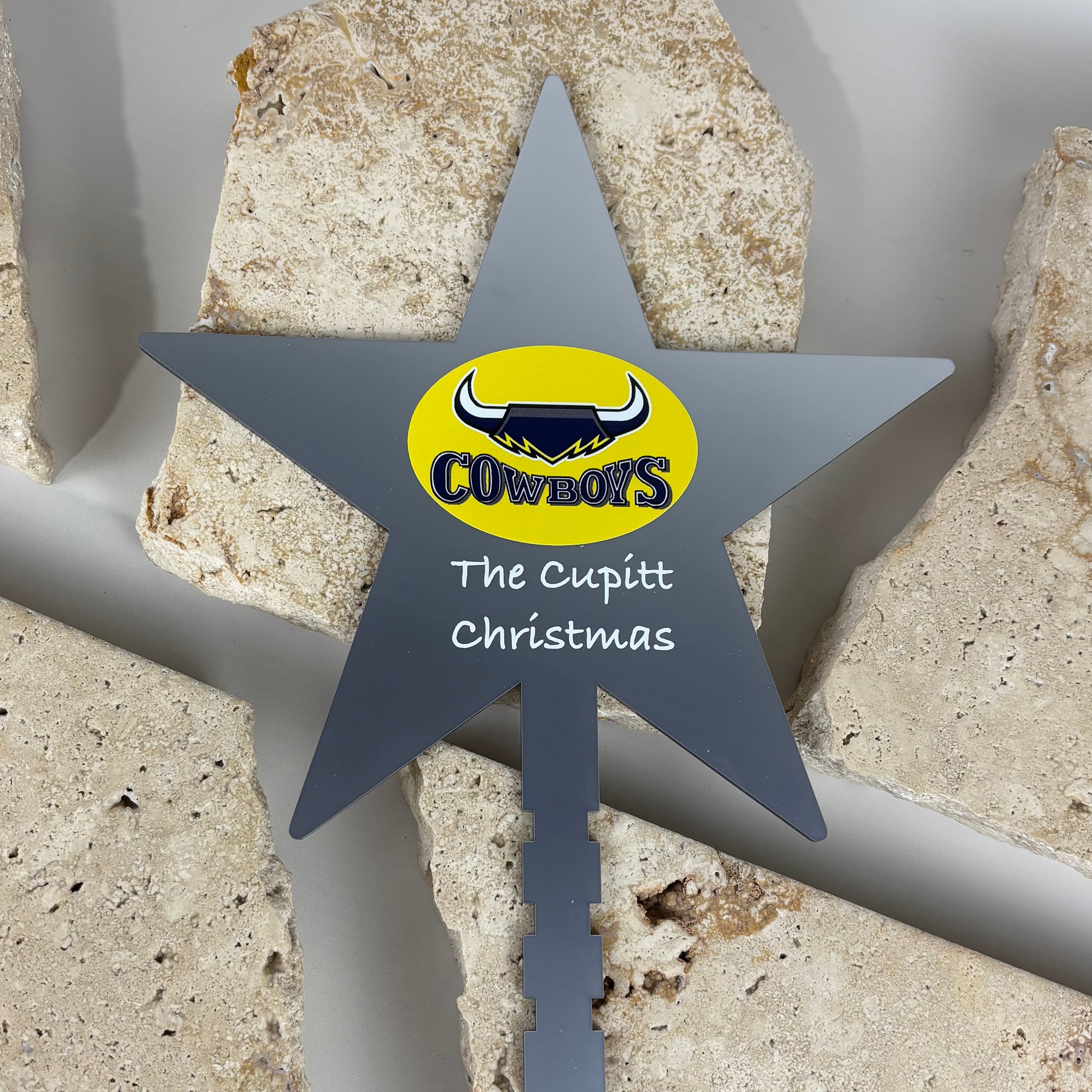 personalised grey acrylic christmas tree star topper with cowboys logo and custom text the cupitt christmas, printed sports themed holiday decoration australia made