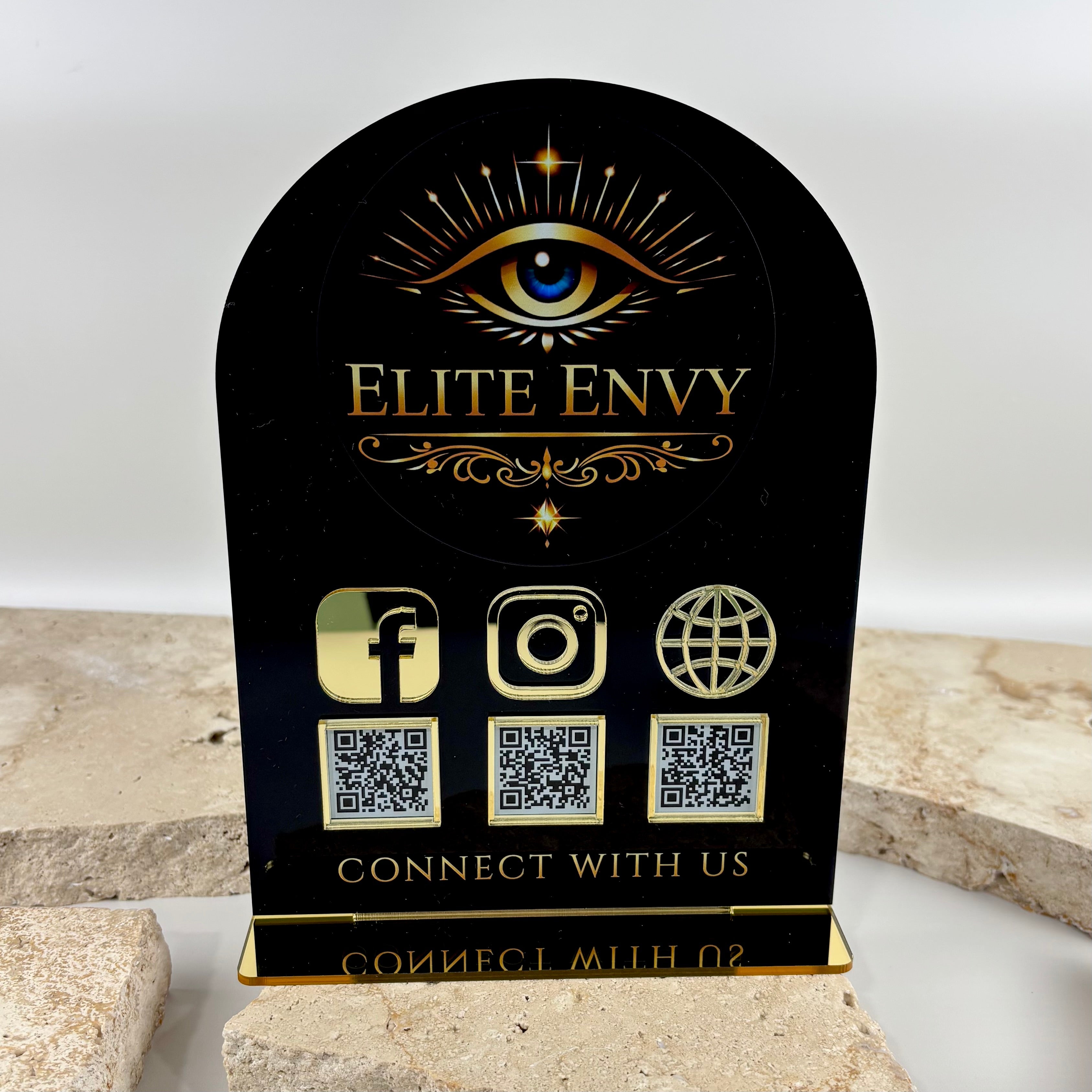 Custom black and gold acrylic social media QR code sign with UV printed logo, Facebook, Instagram and website QR codes for beauty salons, cosmetic clinics, lash artists, brow studios, tattoo studios and small business reception displays.