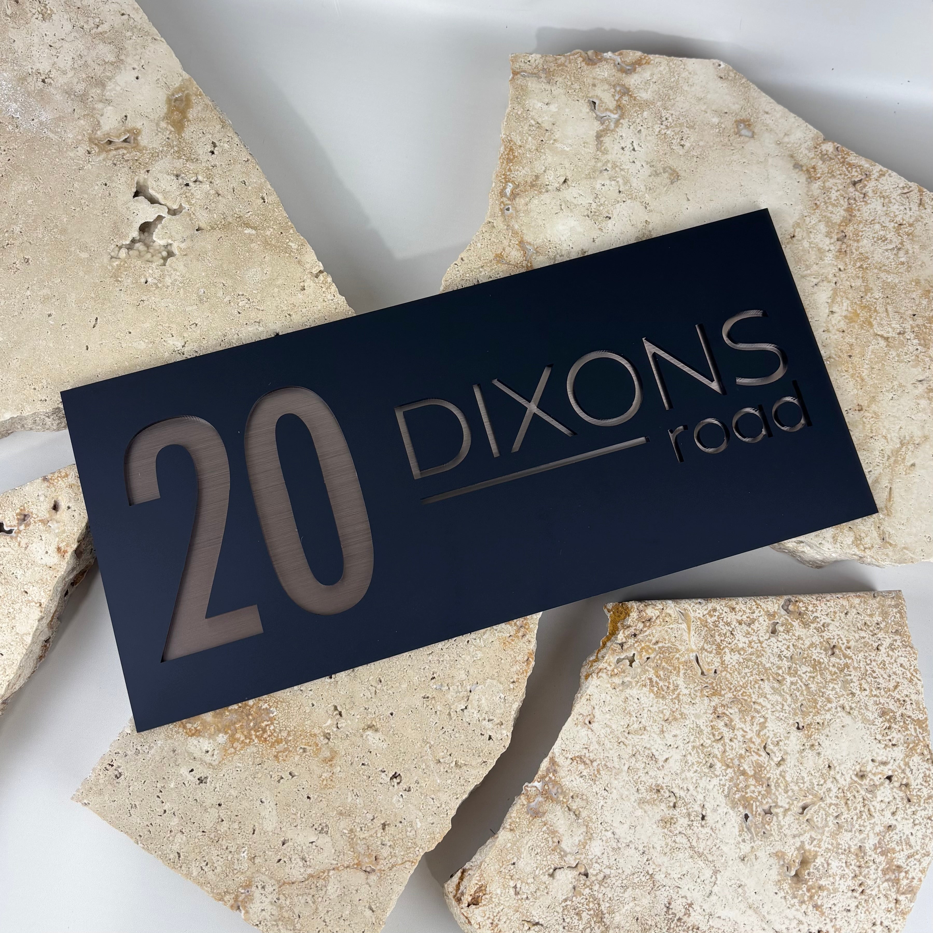 Modern acrylic house address sign with cut out house numbers and street name, custom rectangle address plaque for home exterior signage.