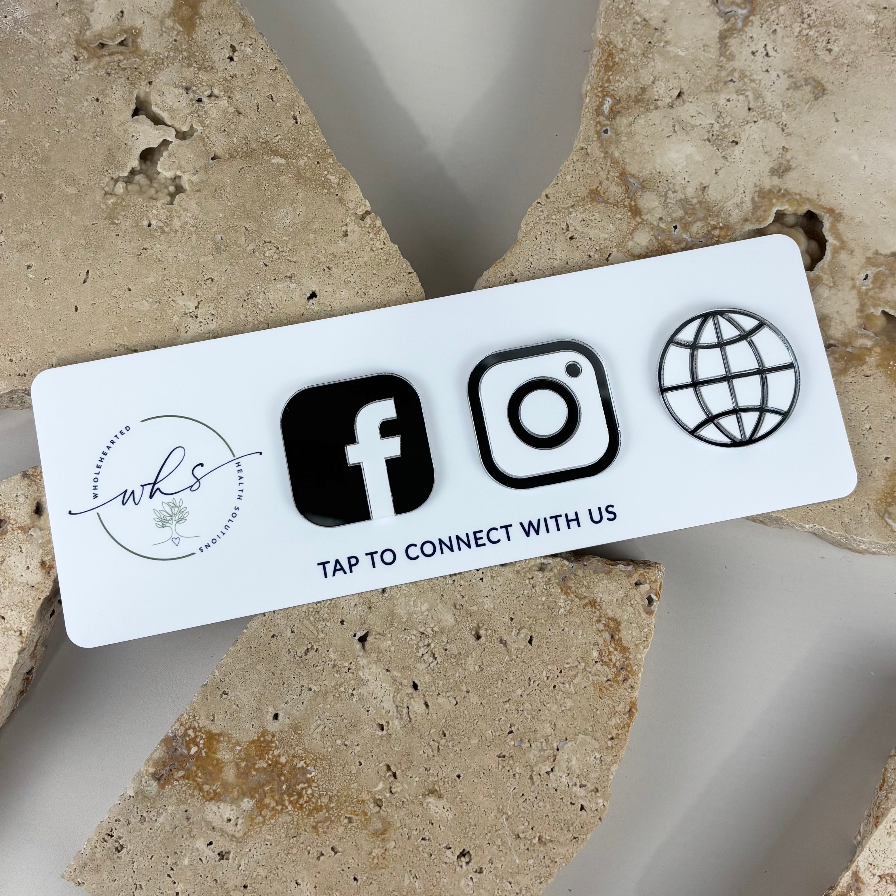 Custom NFC social media stand with raised Facebook and Instagram icons, acrylic tap-to-connect display designed for businesses to instantly share social media profiles and website links with a phone tap.