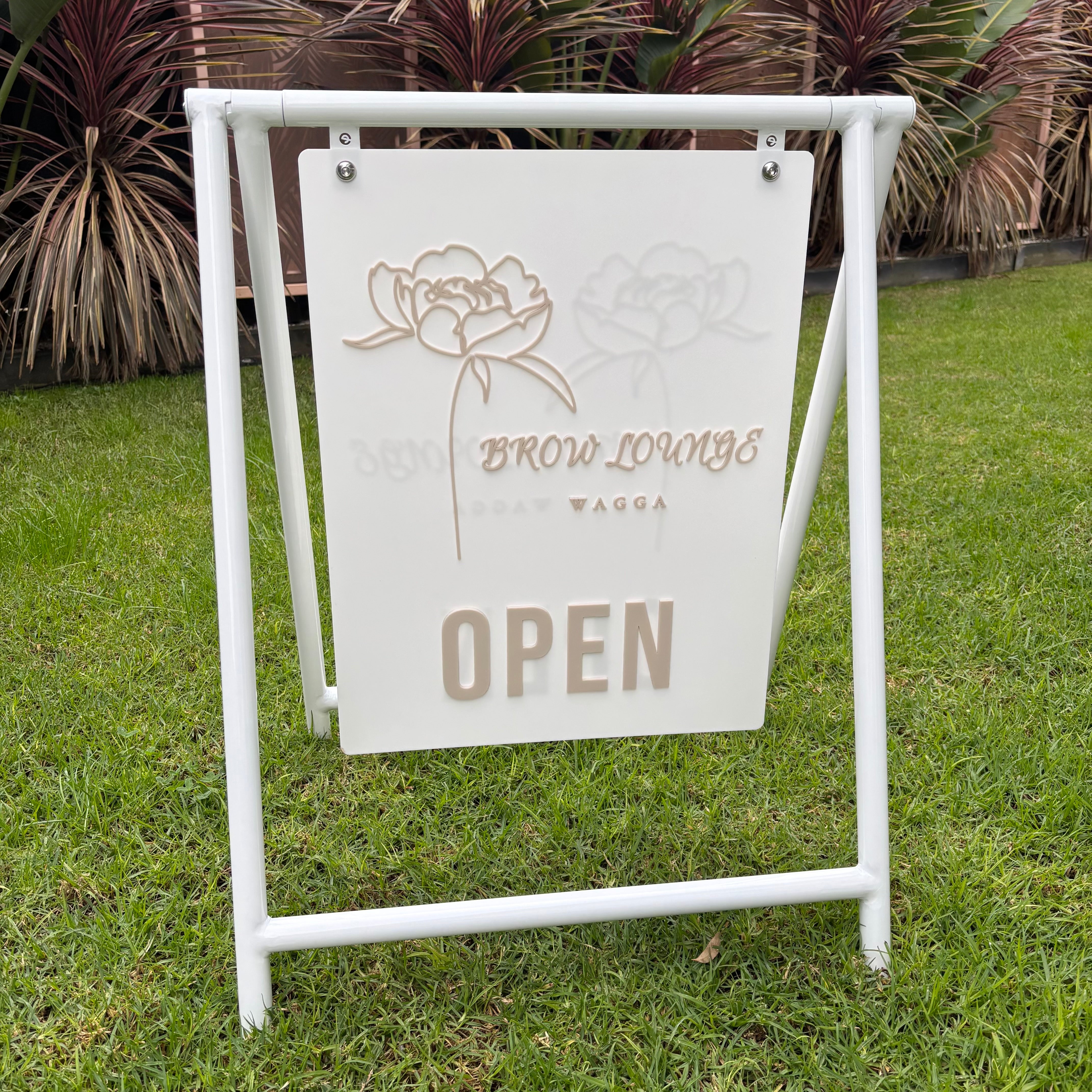 Custom swing pavement business sign with personalised 3D acrylic logo and open sign, freestanding outdoor signage for beauty salons, brow studios, shops and small businesses.