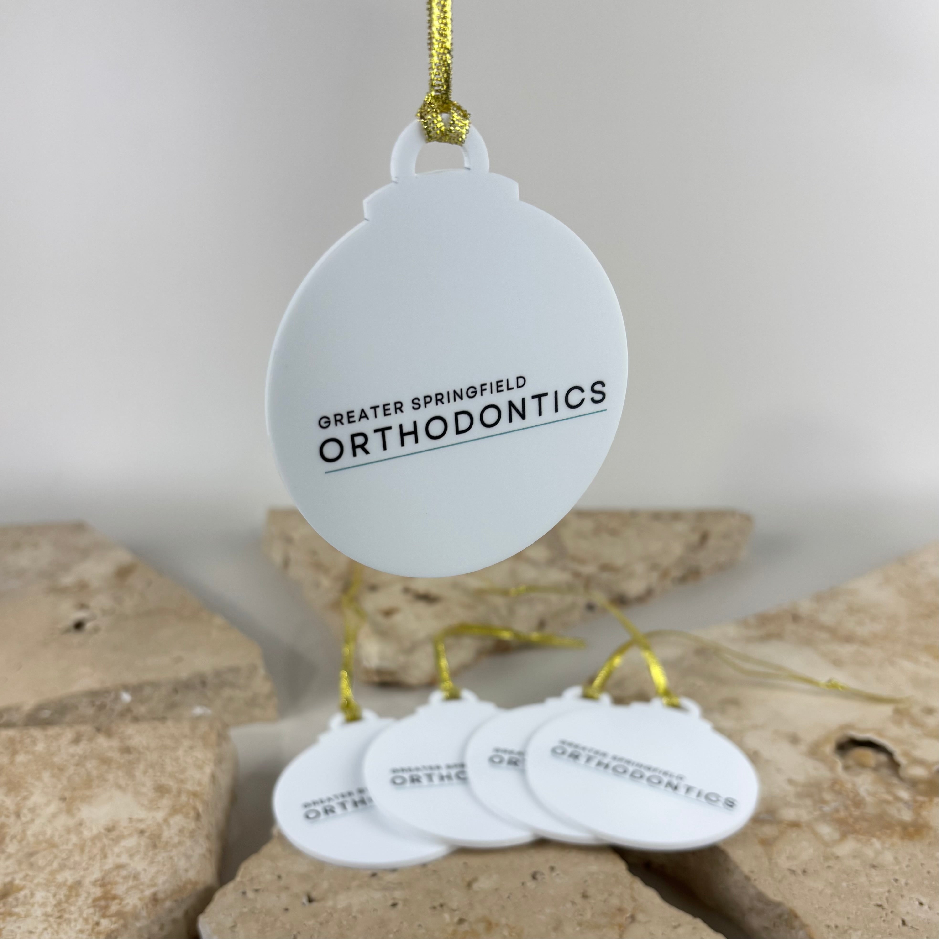 Custom acrylic Christmas bauble with UV printed business logo, personalised corporate Christmas ornament, branded Christmas tree decoration, custom business promotional gift, acrylic festive keepsake for clients, staff and workplace celebrations.