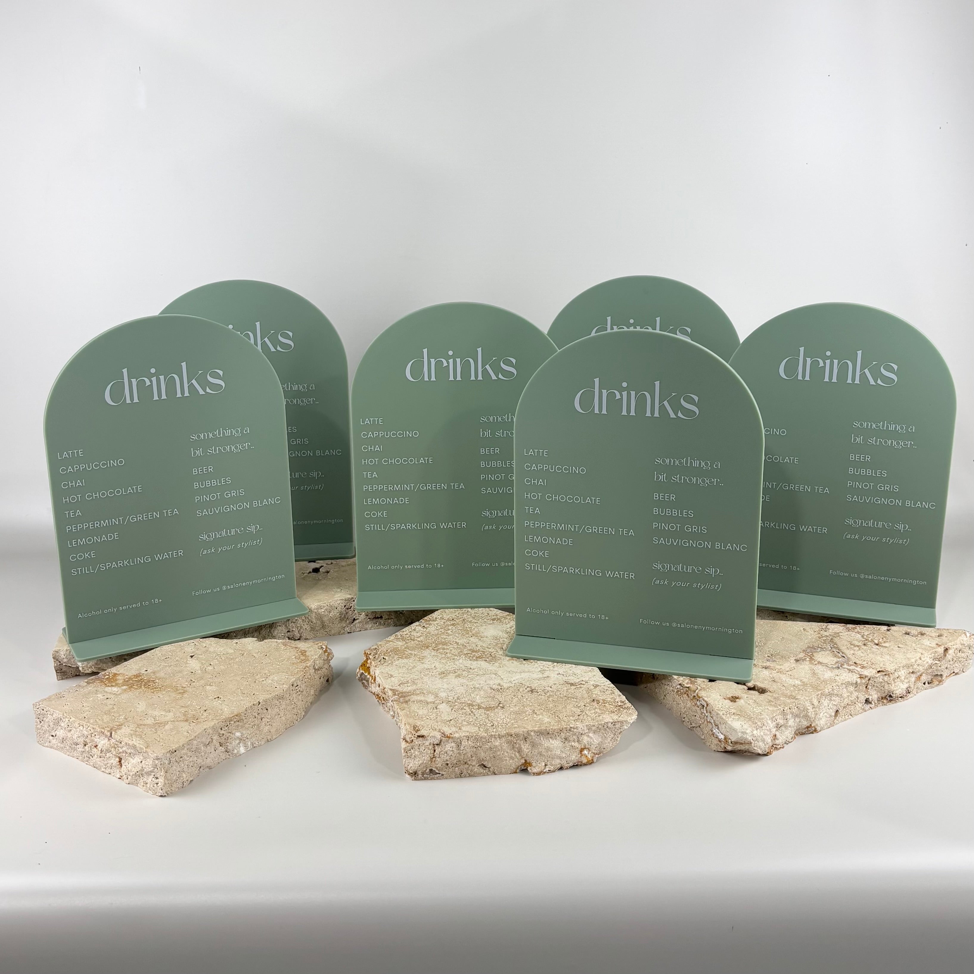 Custom sage green acrylic arched drinks menu signs with white UV printing, freestanding salon menu displays, modern business signage for hair salons, cafes and beauty clinics, reusable countertop menu boards Australia.