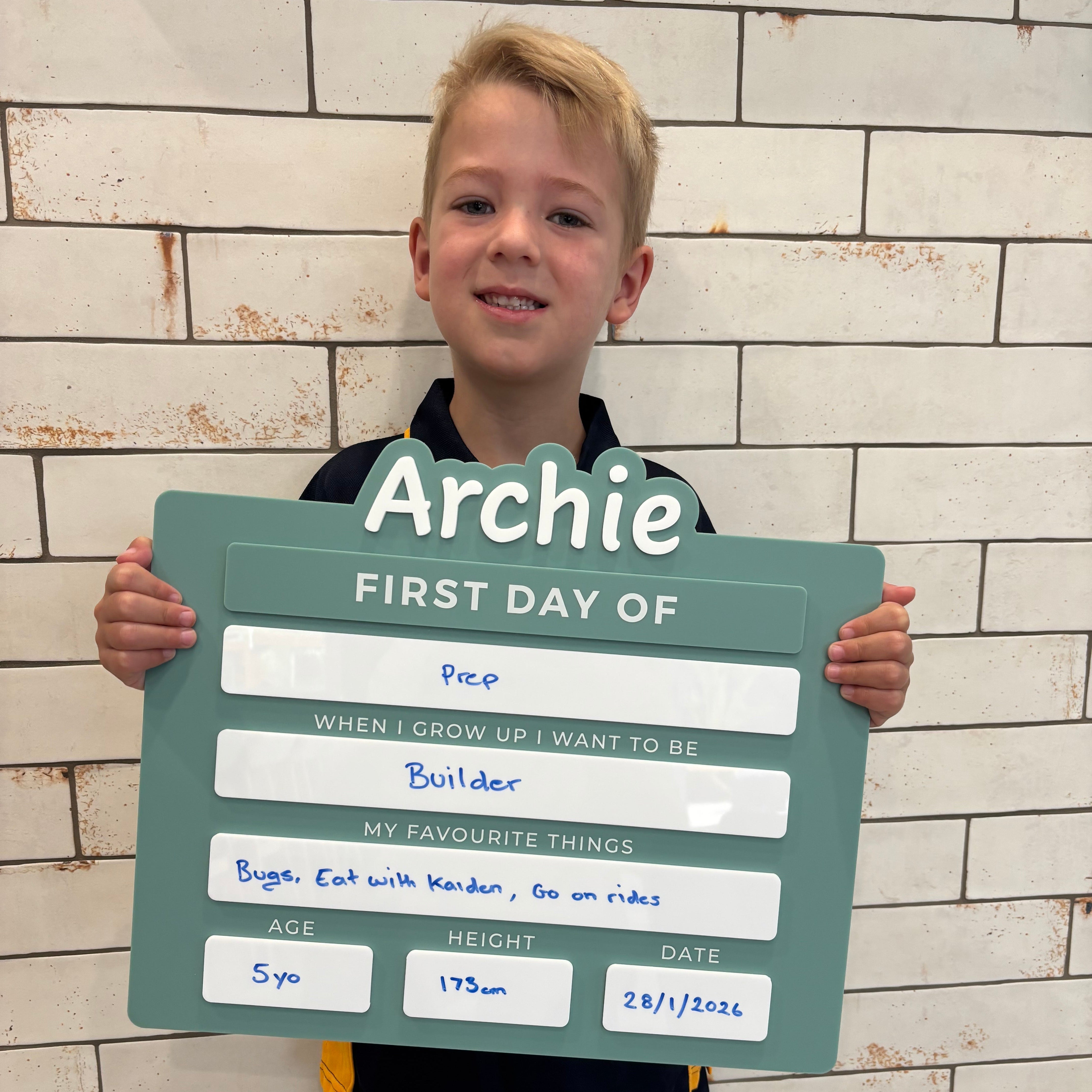 child holding personalised first day of school board prep milestone sign reusable acrylic back to school photo prop