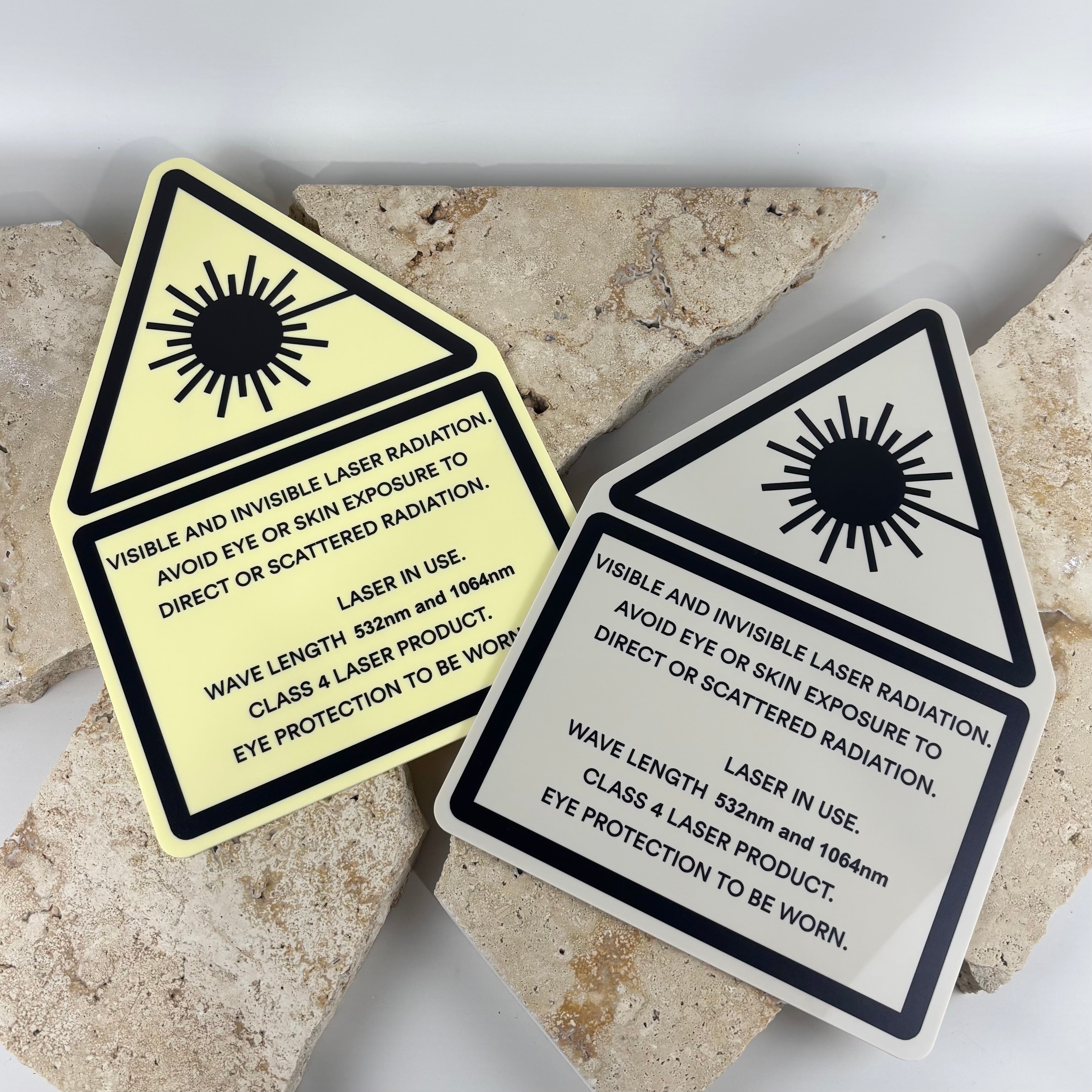 Custom laser radiation warning signs for cosmetic laser clinics, beauty salons and medical aesthetics businesses, UV printed acrylic safety signage featuring Class 4 laser warning symbols, wavelength information and eye protection requirements for treatment rooms.