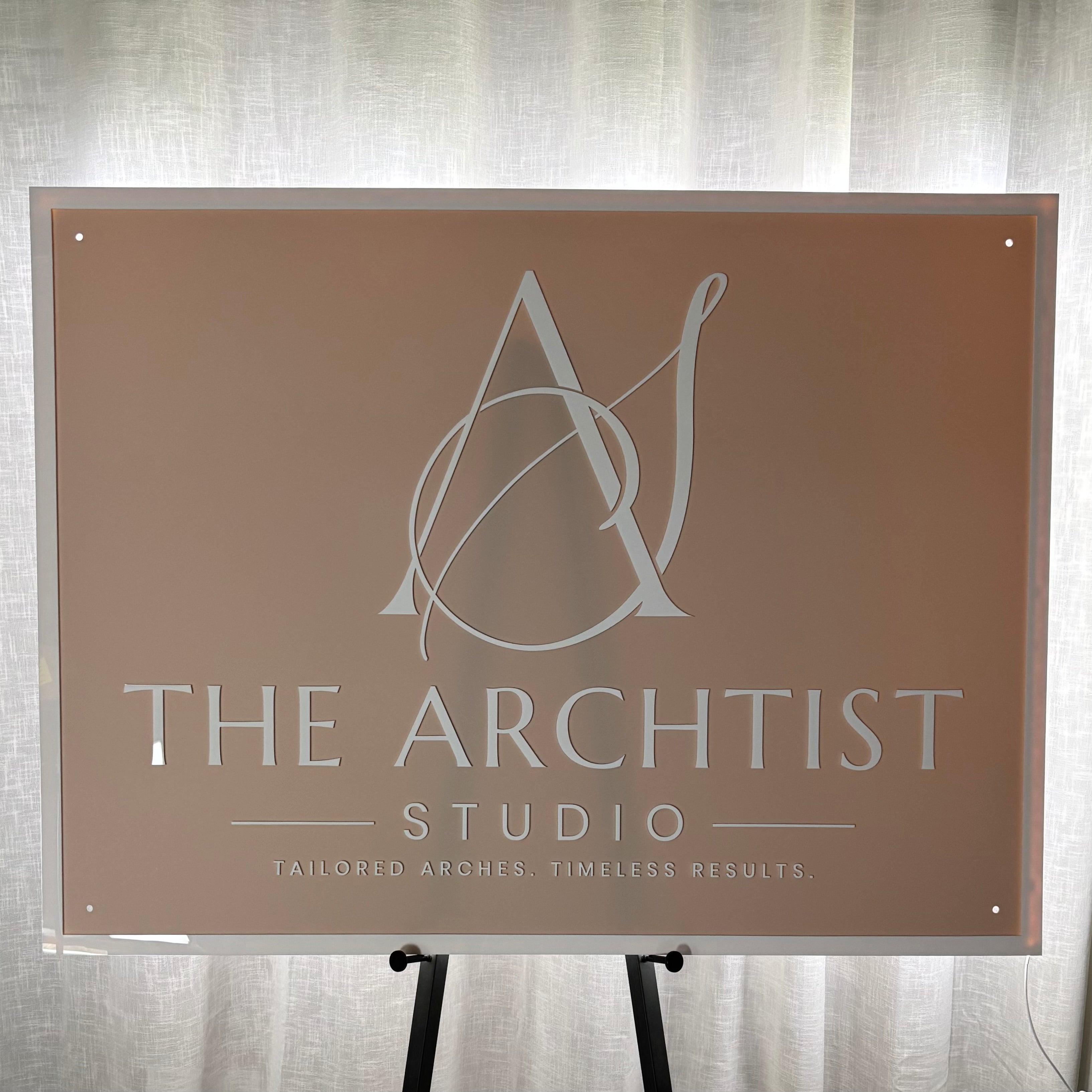 Luxury LED backlit acrylic business sign with illuminated halo glow and raised 3D lettering, custom salon and beauty studio signage for clinics, cosmetic businesses and storefront branding in Australia and New Zealand.
