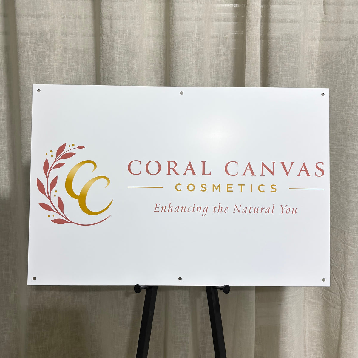 Custom aluminium business sign for Coral Canvas Cosmetics featuring a white aluminium panel with UV printed pink and gold logo, business name and tagline, pre-drilled mounting holes for easy installation, suitable for outdoor storefronts, beauty salons, cosmetic clinics and commercial signage.
