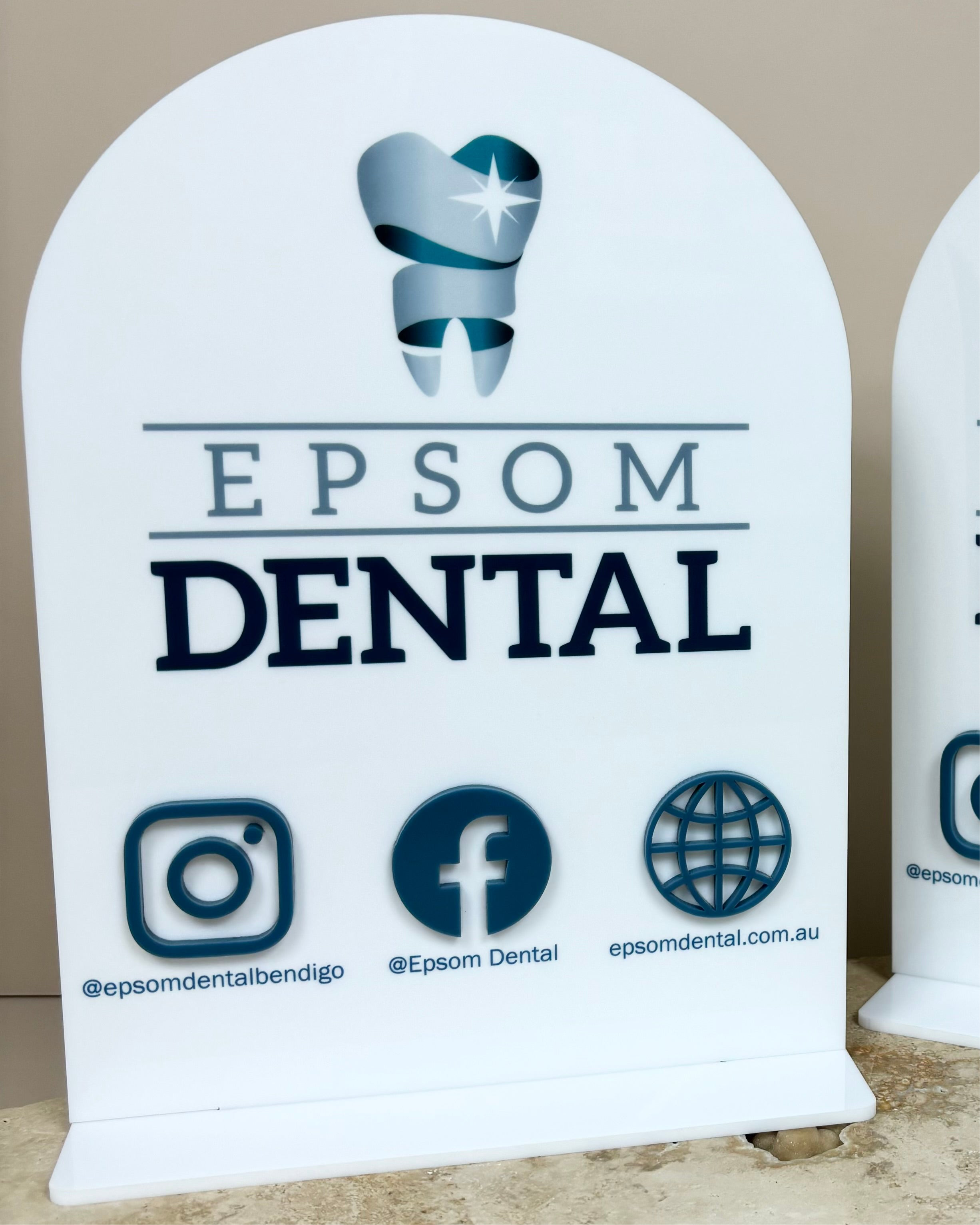 Dental clinic arched QR code sign with social media handles and logo