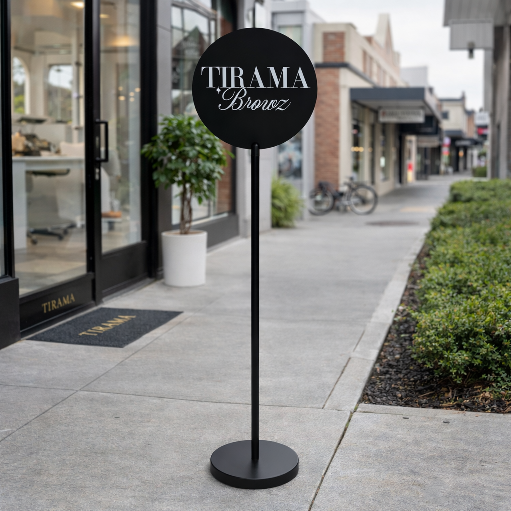 Freestanding metal floor sign stand for salons and clinics, featuring a custom round business sign ideal for indoor and outdoor commercial signage