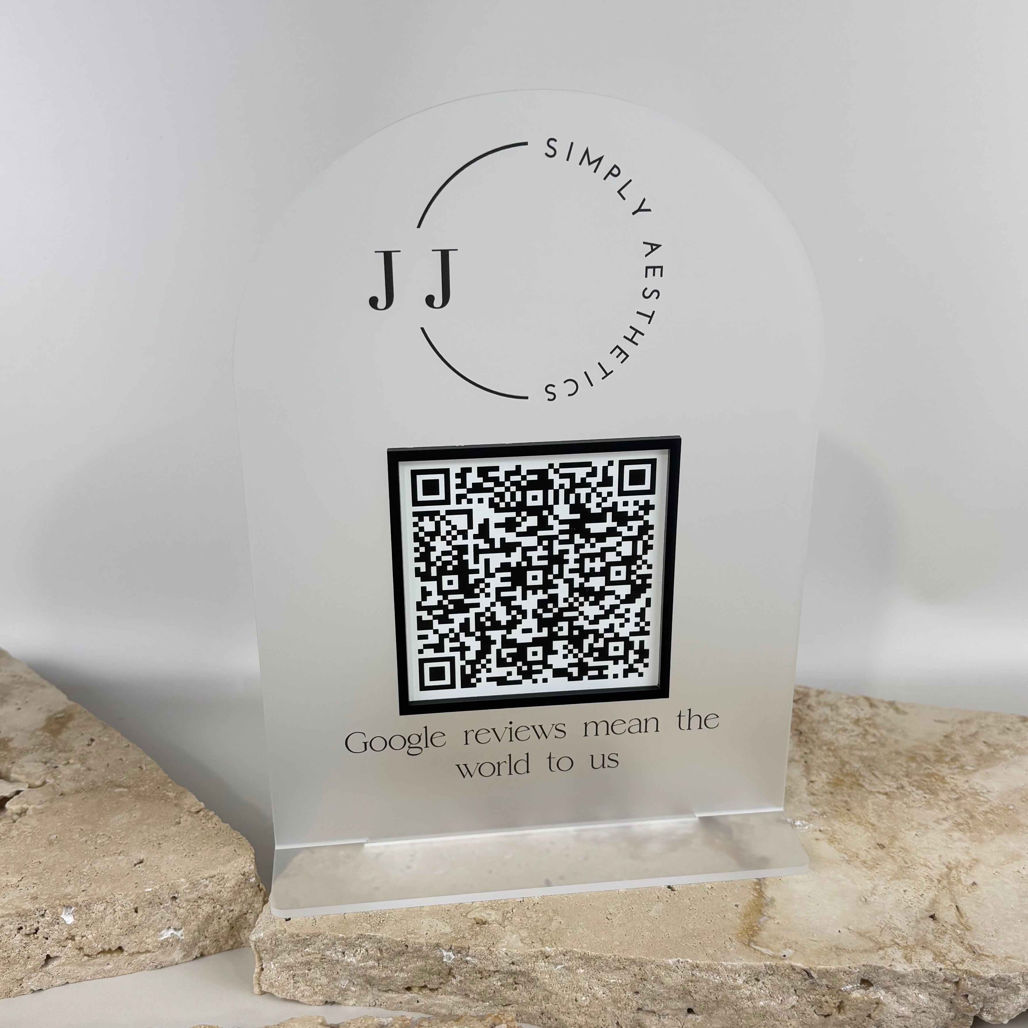 Custom frosted acrylic Google review stand with QR code and minimalist business logo, modern countertop sign designed to encourage customers to scan and leave a Google review.