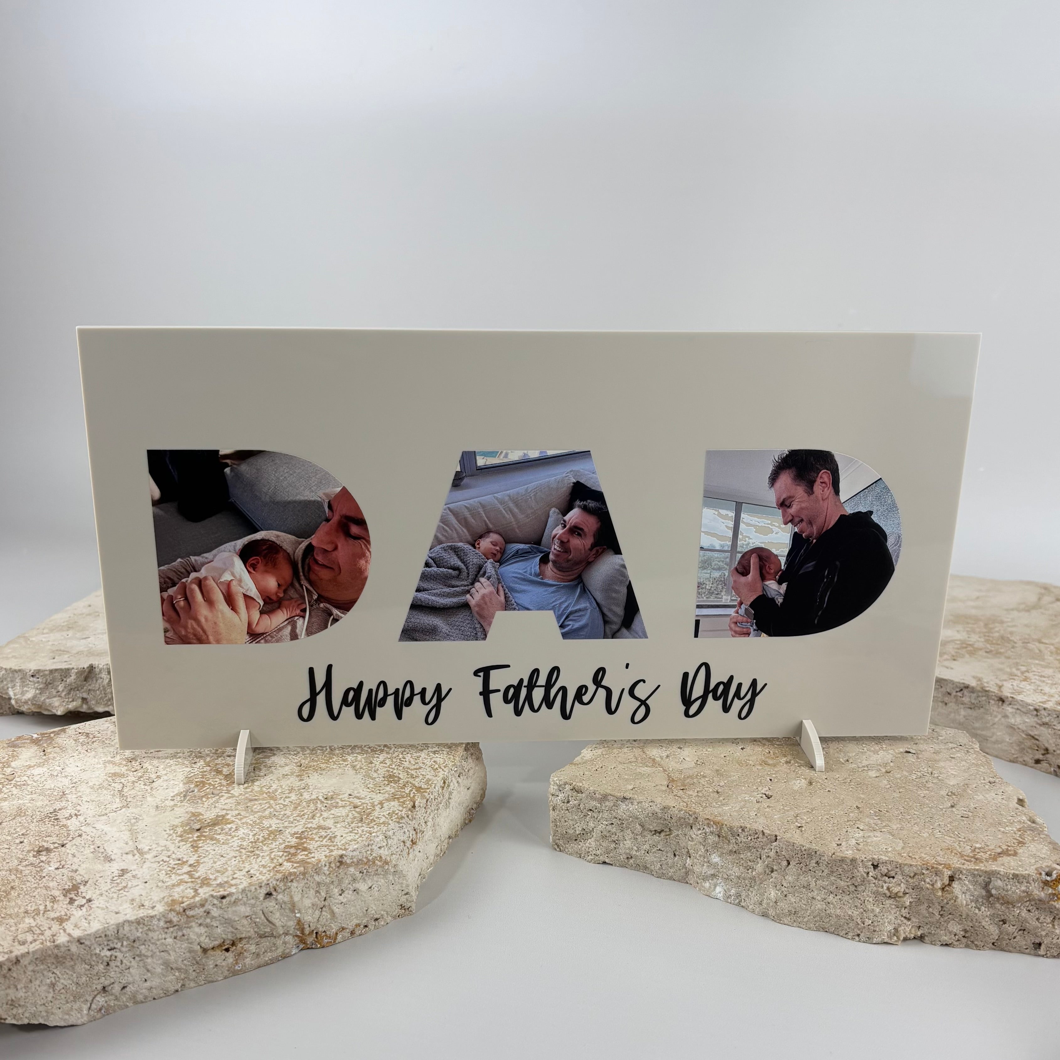 Personalised acrylic Father’s Day photo plaque featuring three custom family photos inside DAD lettering with “Happy Father’s Day” text and freestanding feet.