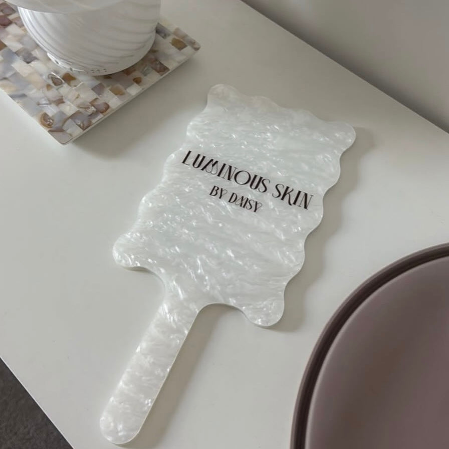 Custom pearl acrylic handheld mirror with logo branding for beauty salons and skin clinics, luxury aesthetic salon mirror for client consultations and social media content