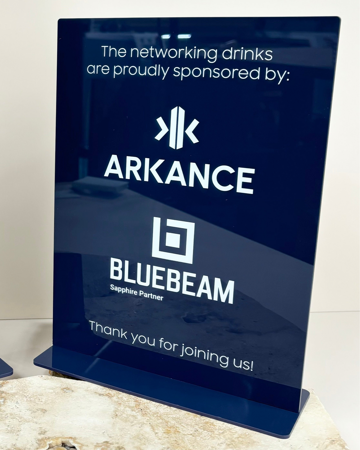 Navy blue branded sign for sponsored event or business display