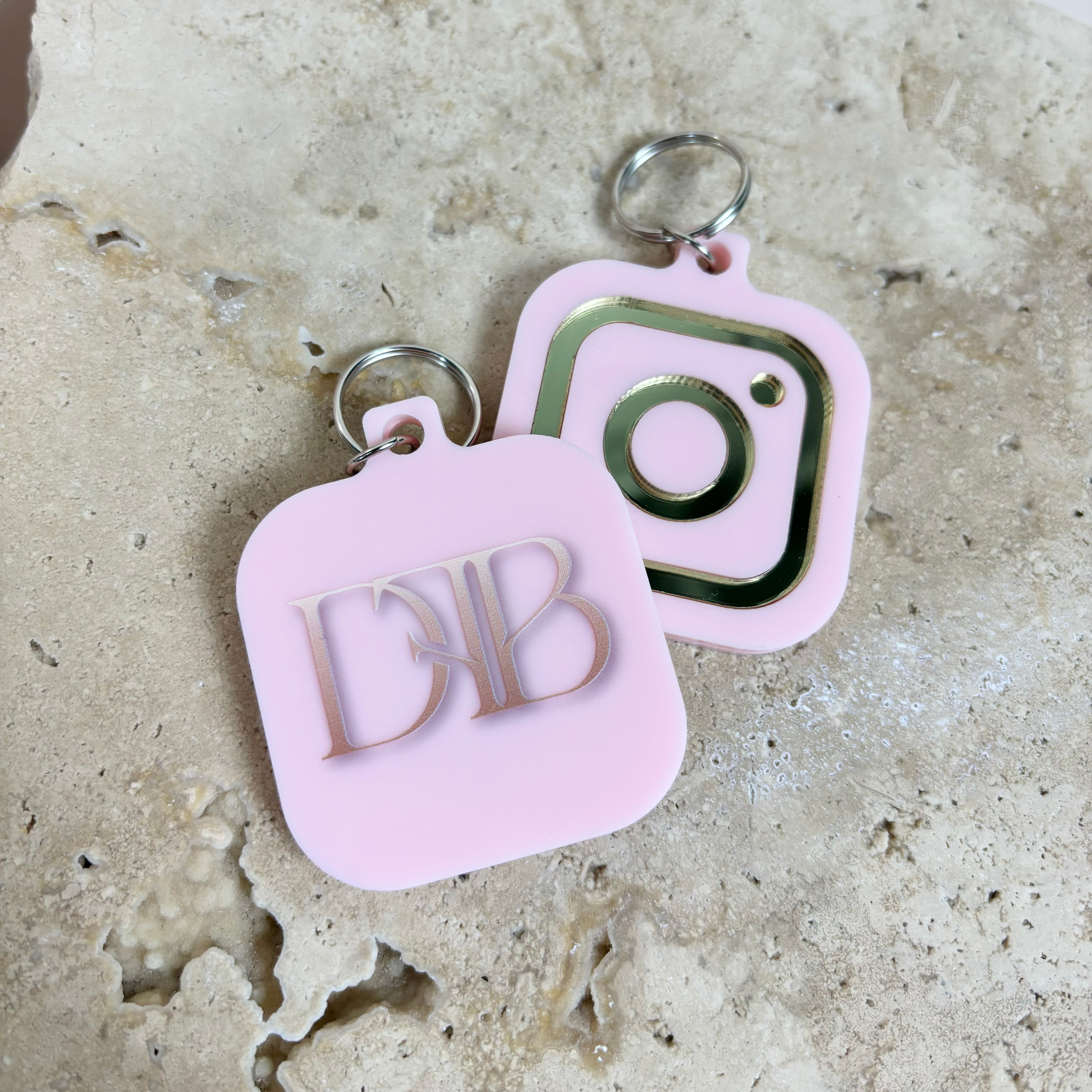 Soft pink and black NFC keychains with Instagram and initials logo design