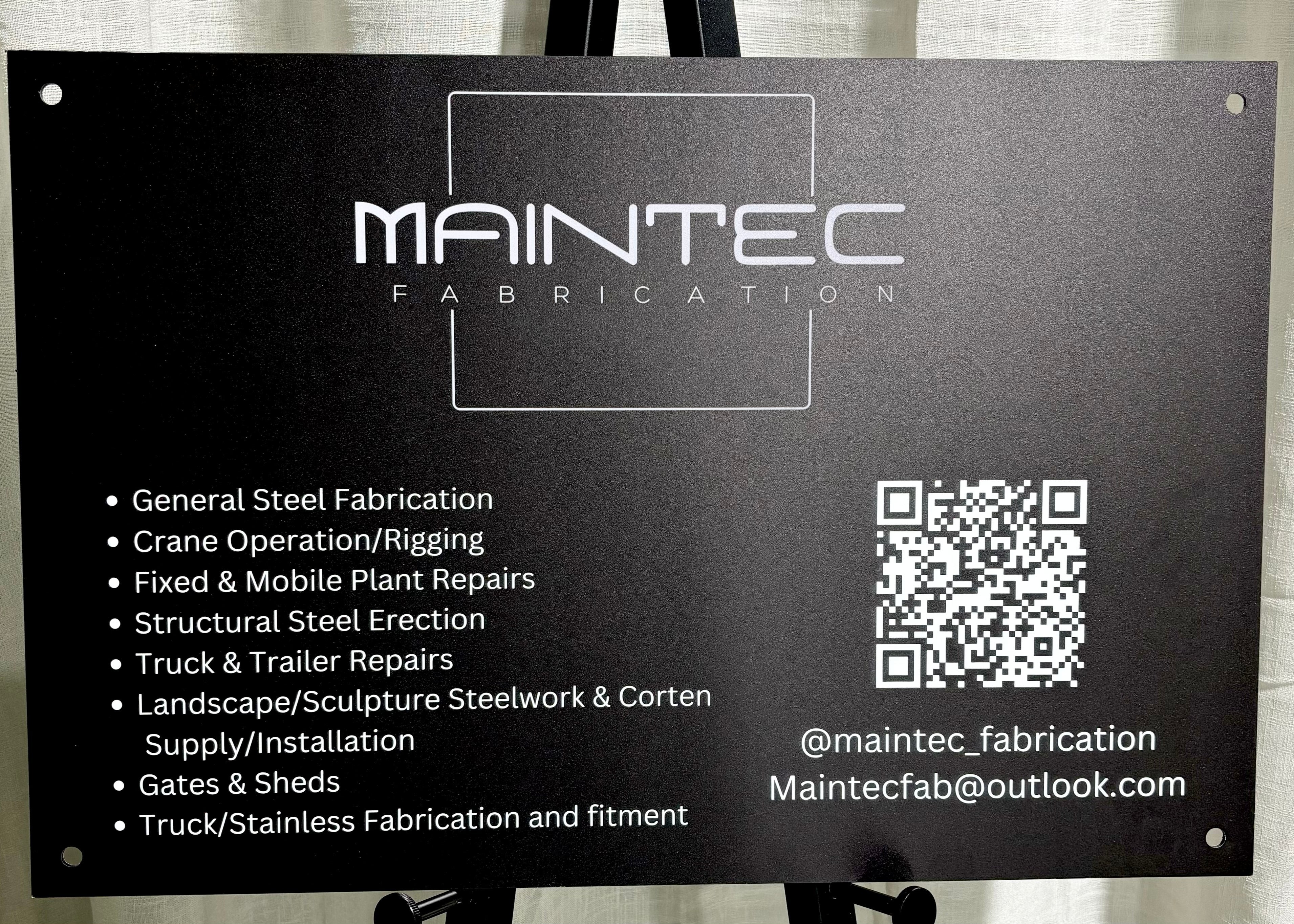 Maintec aluminium sign with QR code, black industrial-style aluminium business sign with tech company branding and scannable code.