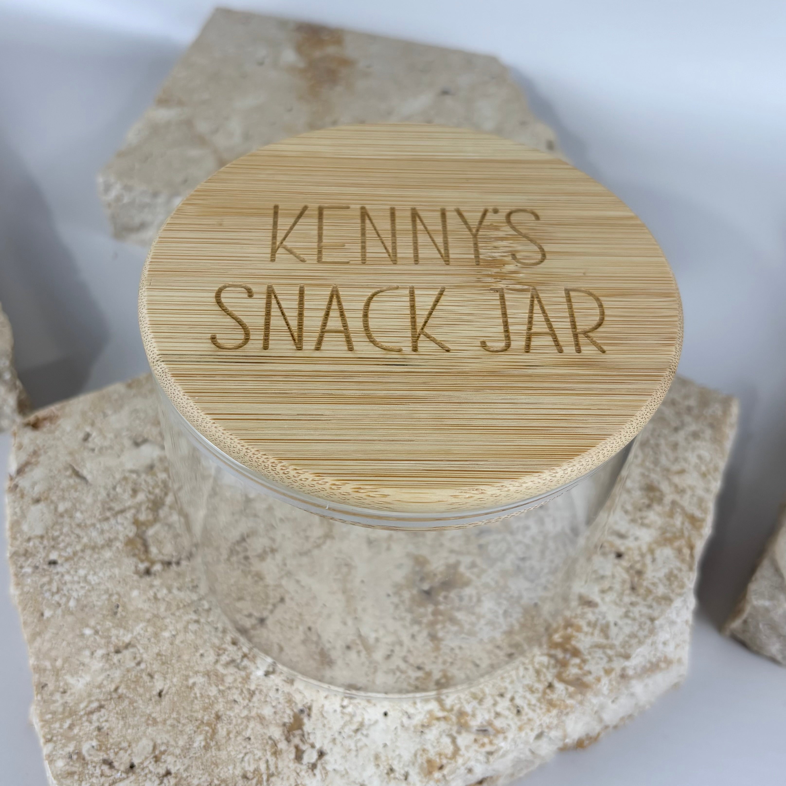 Personalised bamboo snack jar with custom engraved wooden lid, eco-friendly storage container for snacks, kitchen organisation, and gifting.
