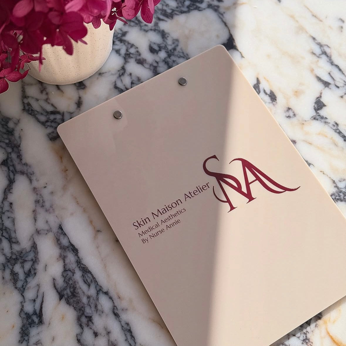 Custom branded acrylic clipboard for beauty salons and aesthetic clinics, personalised nude beige salon clipboard with UV printed logo for client consultations and business branding