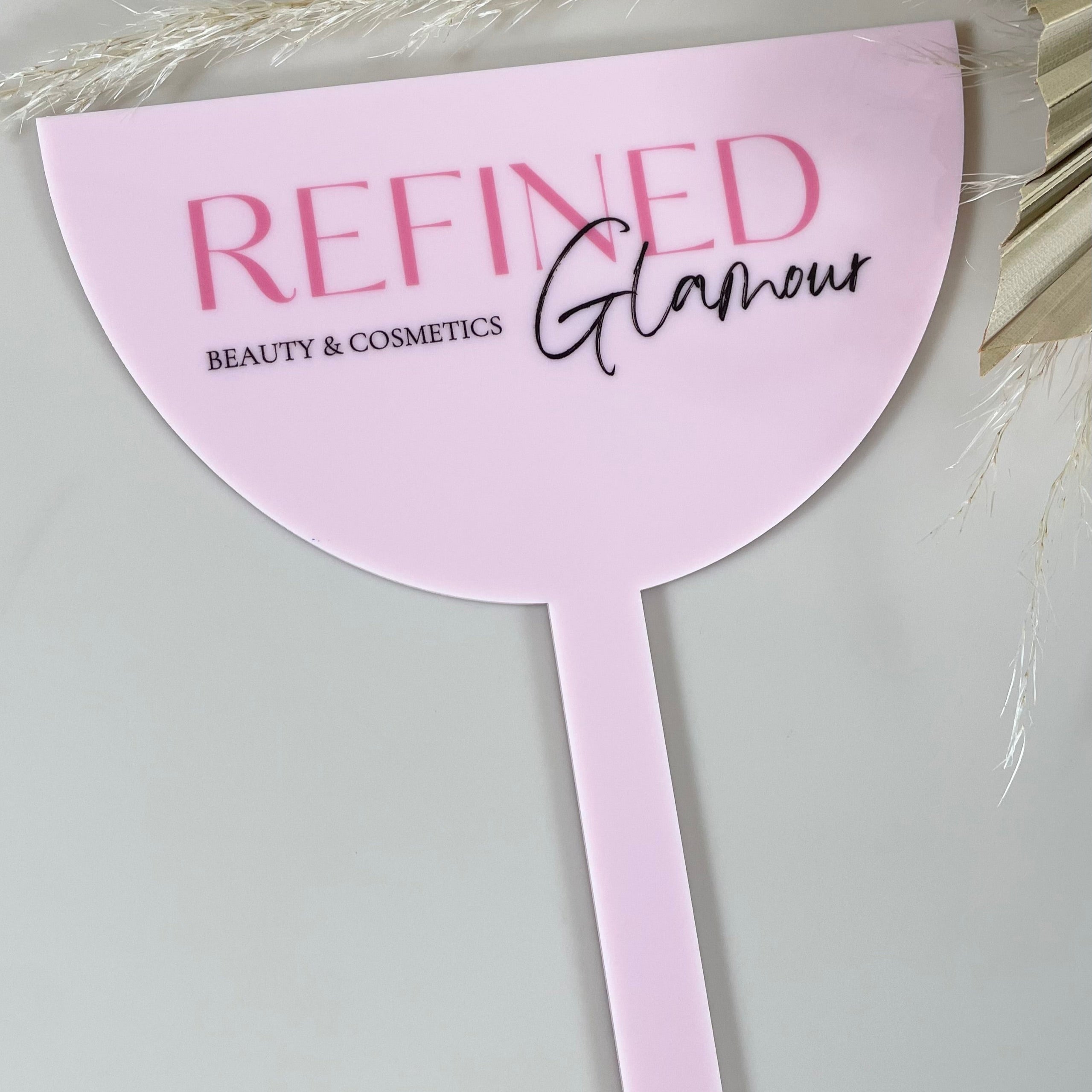 Pink branded face shield with Refined Glamour logo for lash and brow artists