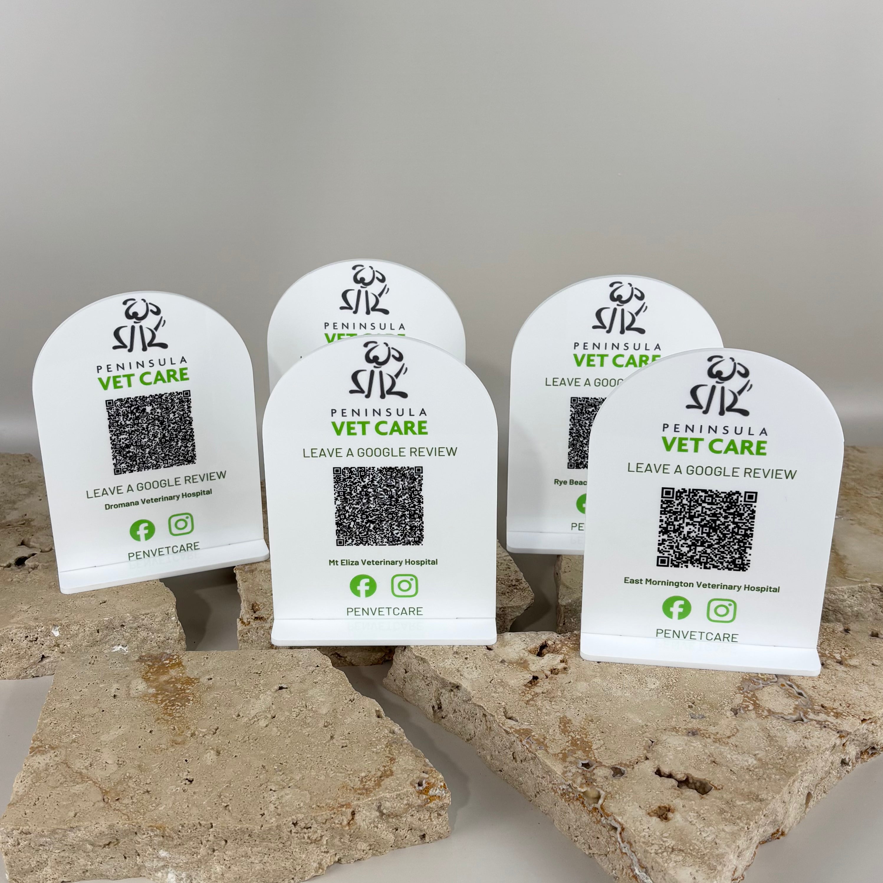 White arched acrylic QR code review signs for veterinary clinics, freestanding counter displays with Peninsula Vet Care branding, Google review QR codes and social icons, professional reception signage for vet hospitals and animal care businesses in Australia.