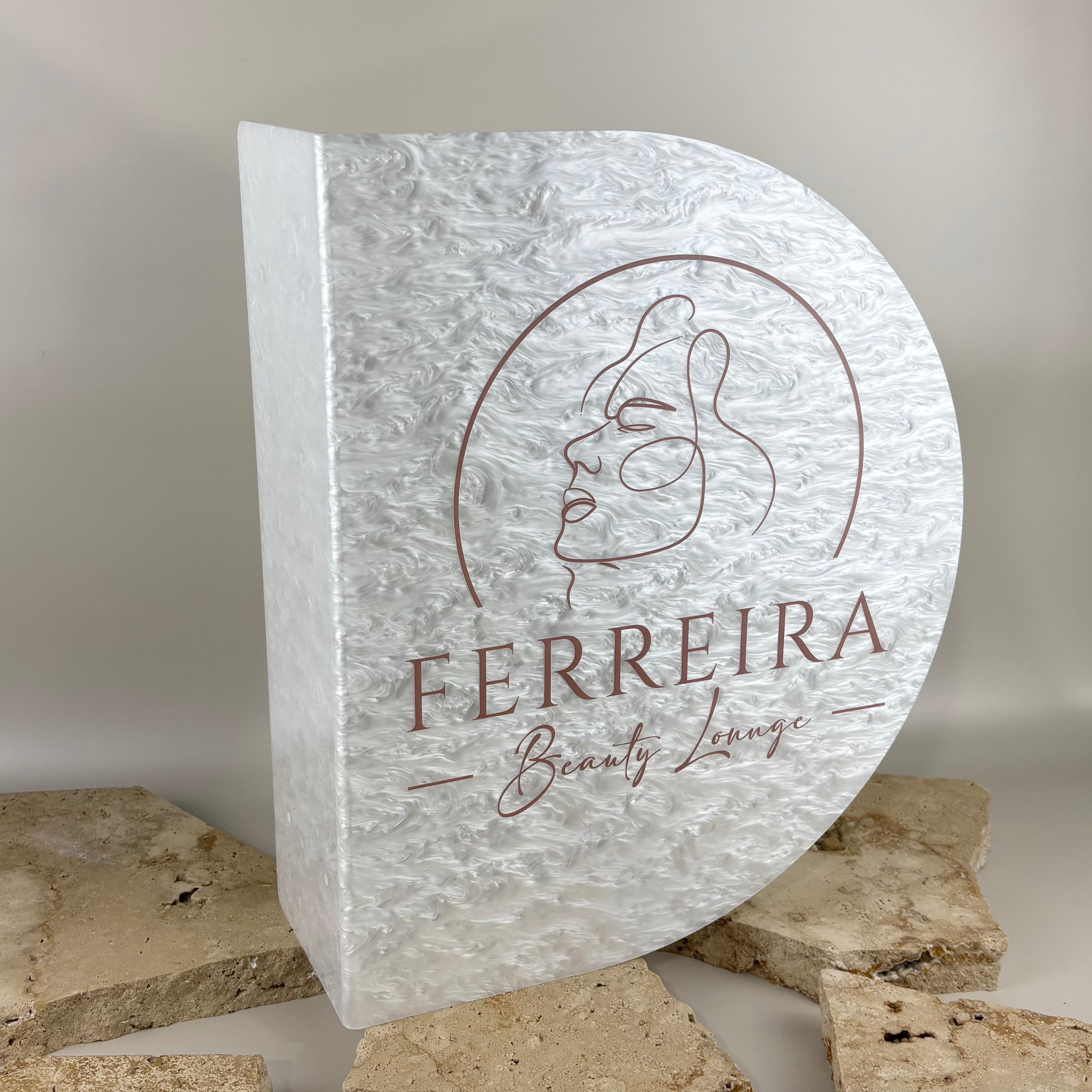 Custom curved acrylic blade sign in white pearl acrylic with personalised business logo, designed for beauty salons, cosmetic clinics and professional business signage.