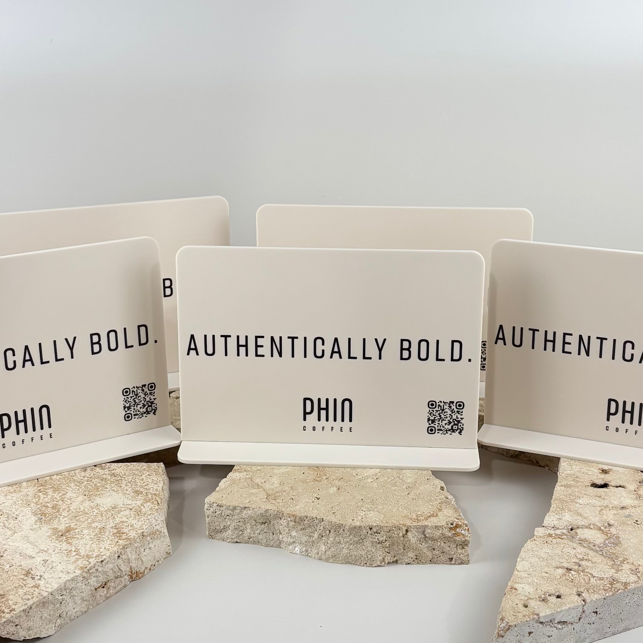 Custom double-sided white acrylic countertop QR code signs with black UV printed PHIN Coffee branding and Authentically Bold text.