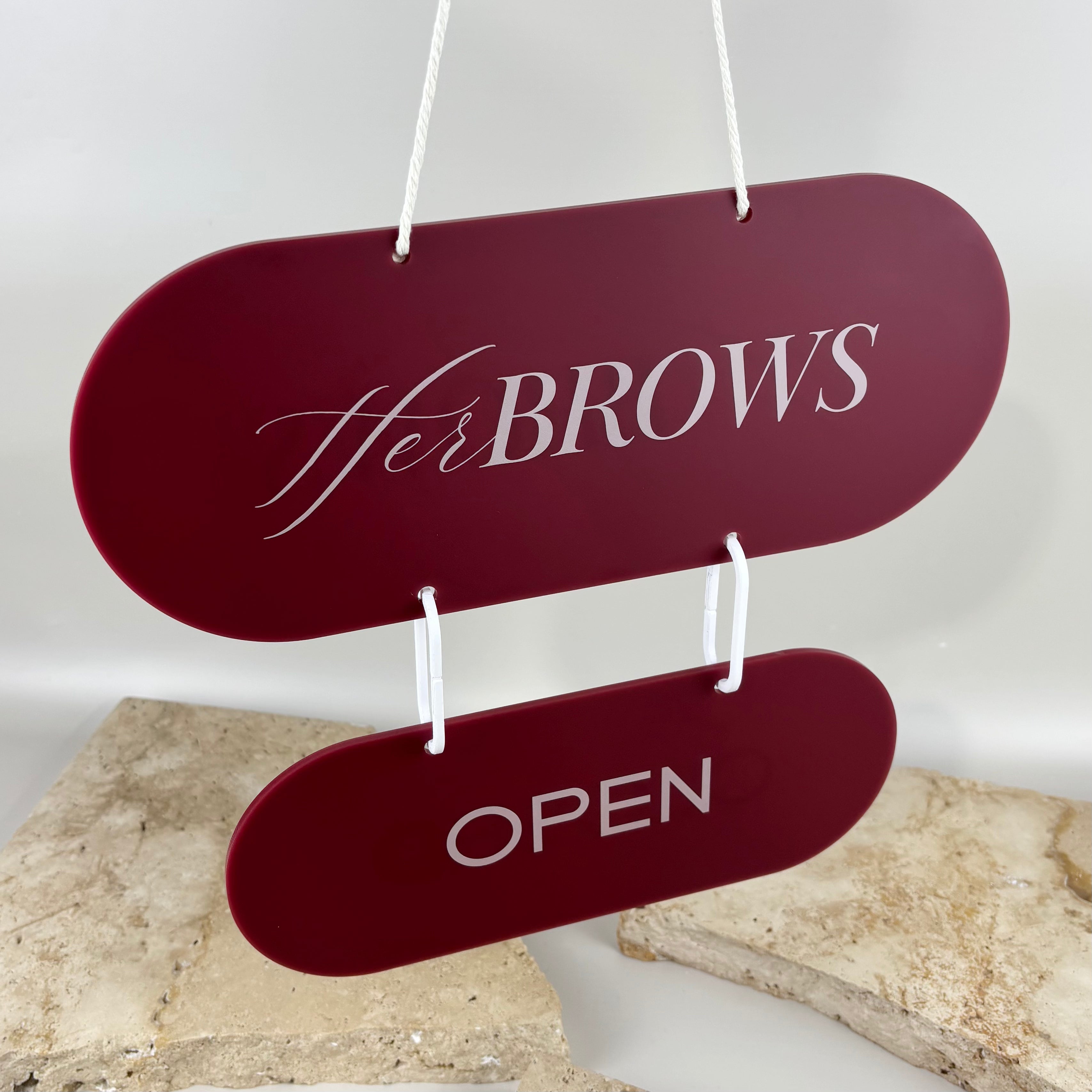 Custom burgundy acrylic open business sign with logo, double-sided capsule hanging door sign for salon, beauty studio or shop.