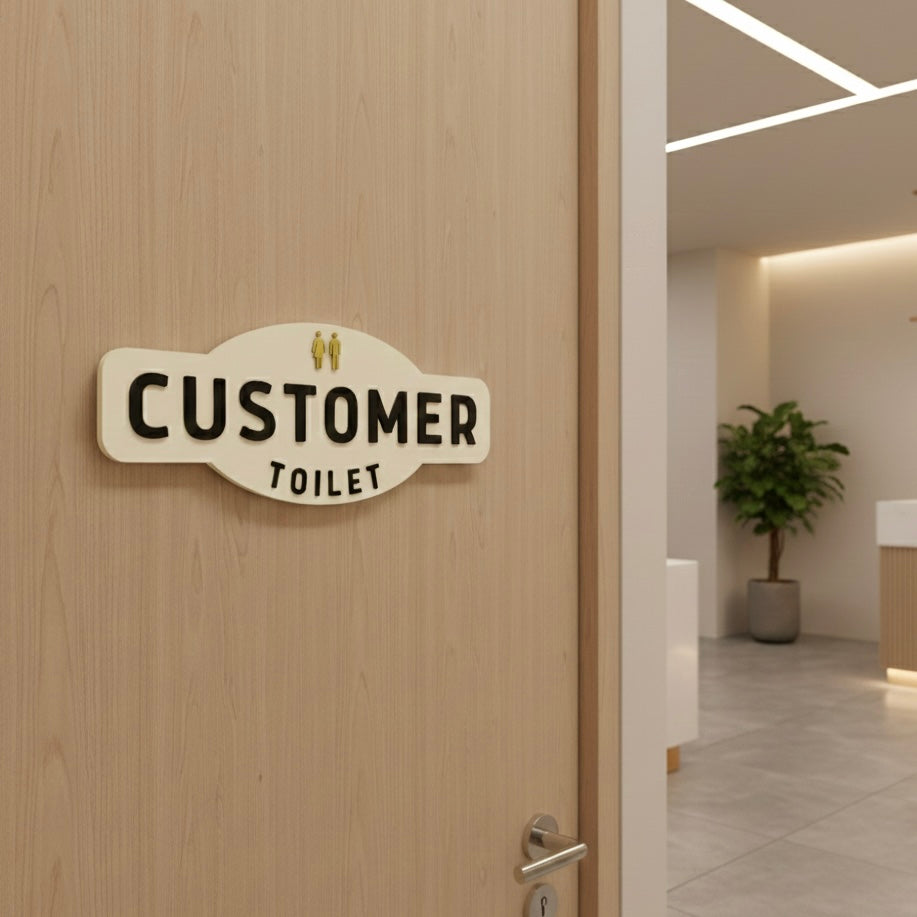 Customer toilet sign mounted on wooden door in modern aesthetic clinic, acrylic bathroom signage for salons and clinics
