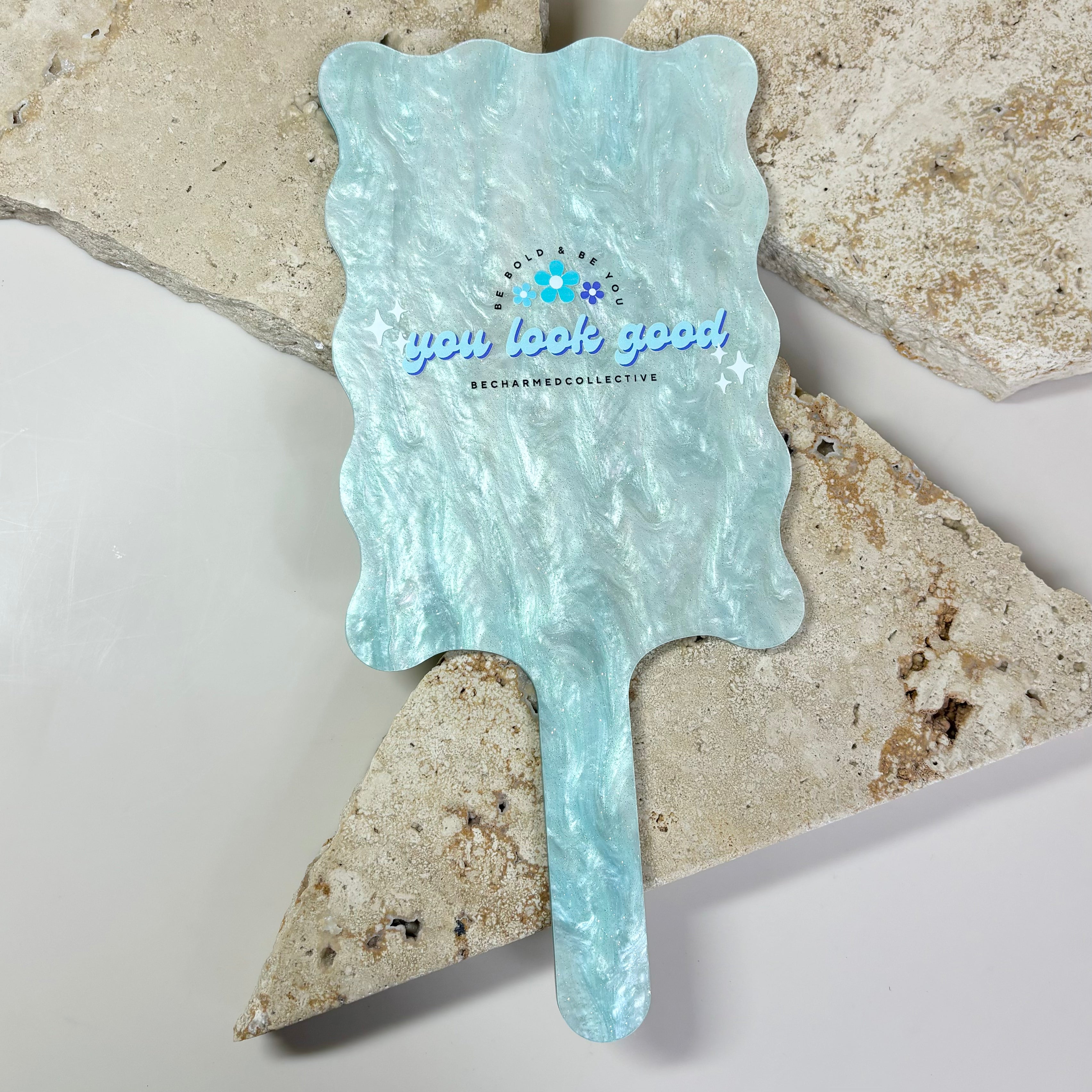 Blue textured wavy handheld mirror with custom business logo
