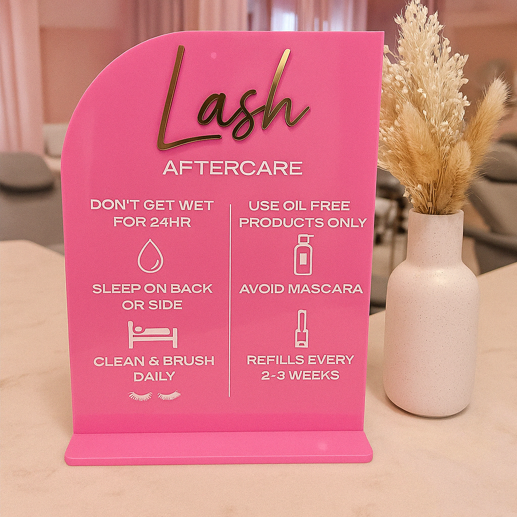Pink curved lash aftercare acrylic sign with custom engraved text
