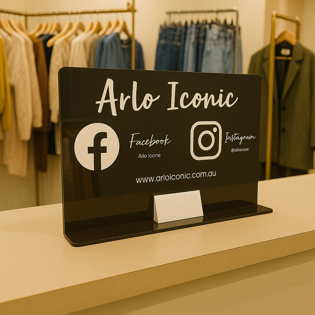 Black acrylic business sign with card holder and social media icons for Arlo Iconic boutique
