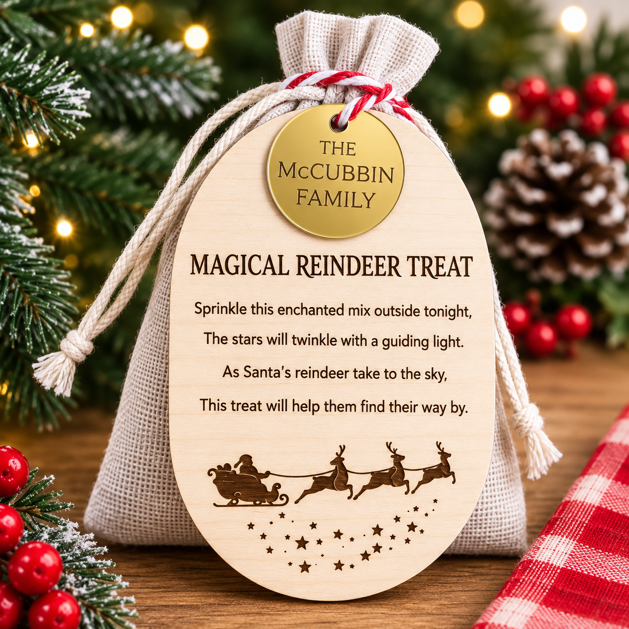 Personalised magical reindeer treat bag with engraved wooden tag, custom family name plaque and reusable linen drawstring pouch for Christmas Eve reindeer food tradition.