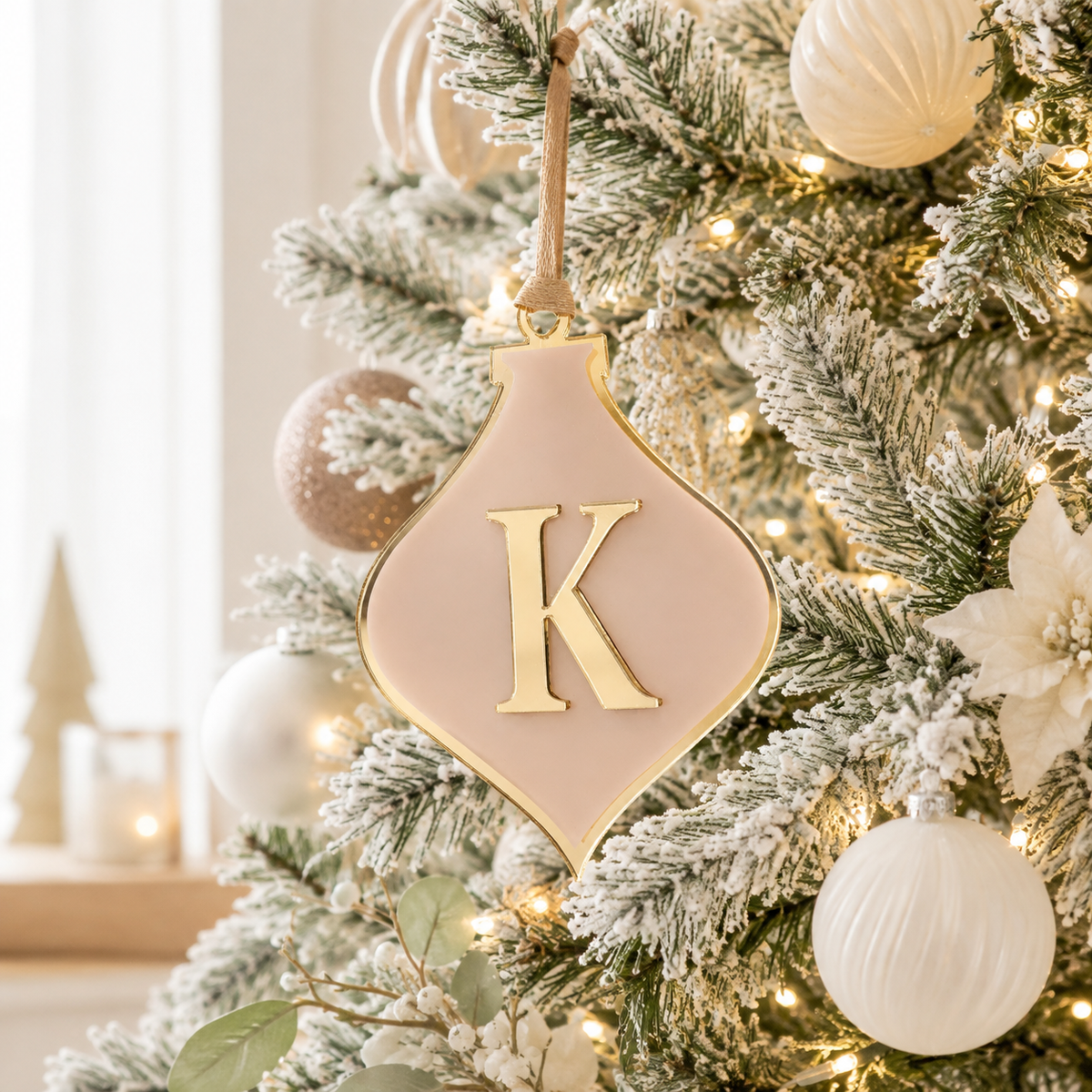 Personalised pink and gold acrylic Christmas bauble with 3D mirror initial, custom name ornament for modern Christmas tree décor.