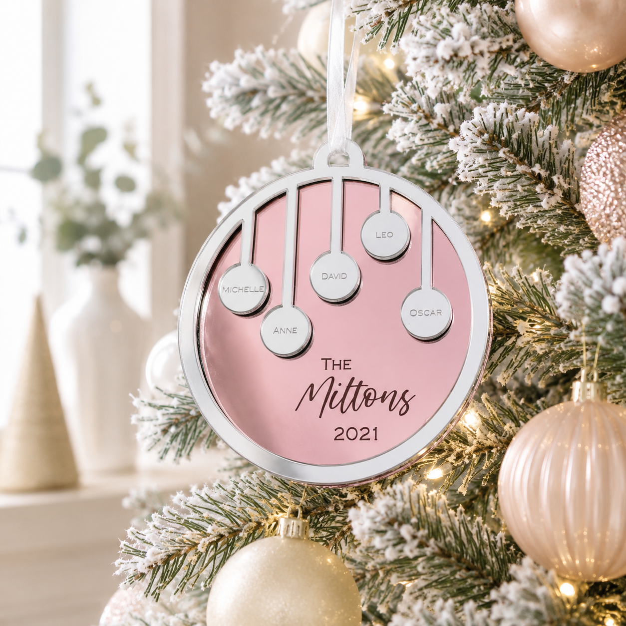 Personalised family Christmas bauble in pink and silver mirror acrylic with custom names, family surname and year, Christmas tree ornament.