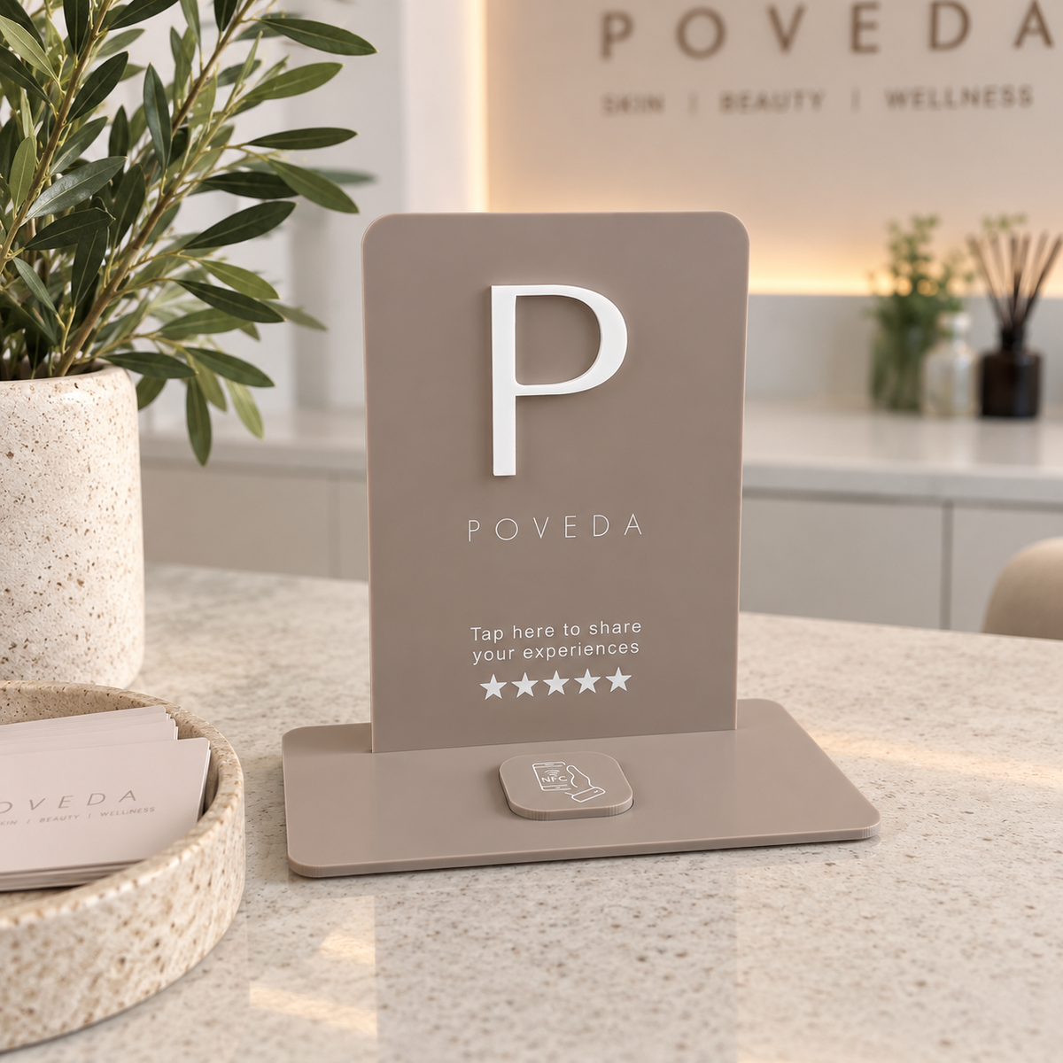 Custom NFC Google review stand displayed on a modern business counter, featuring personalised branding and tap-to-review technology for salons, clinics and retail businesses.